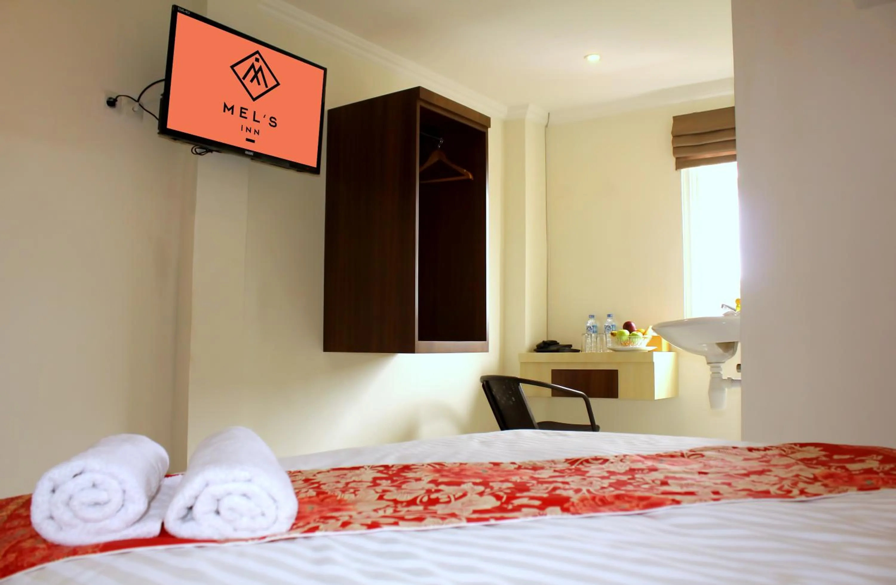 Bed in Mel's Inn Manado