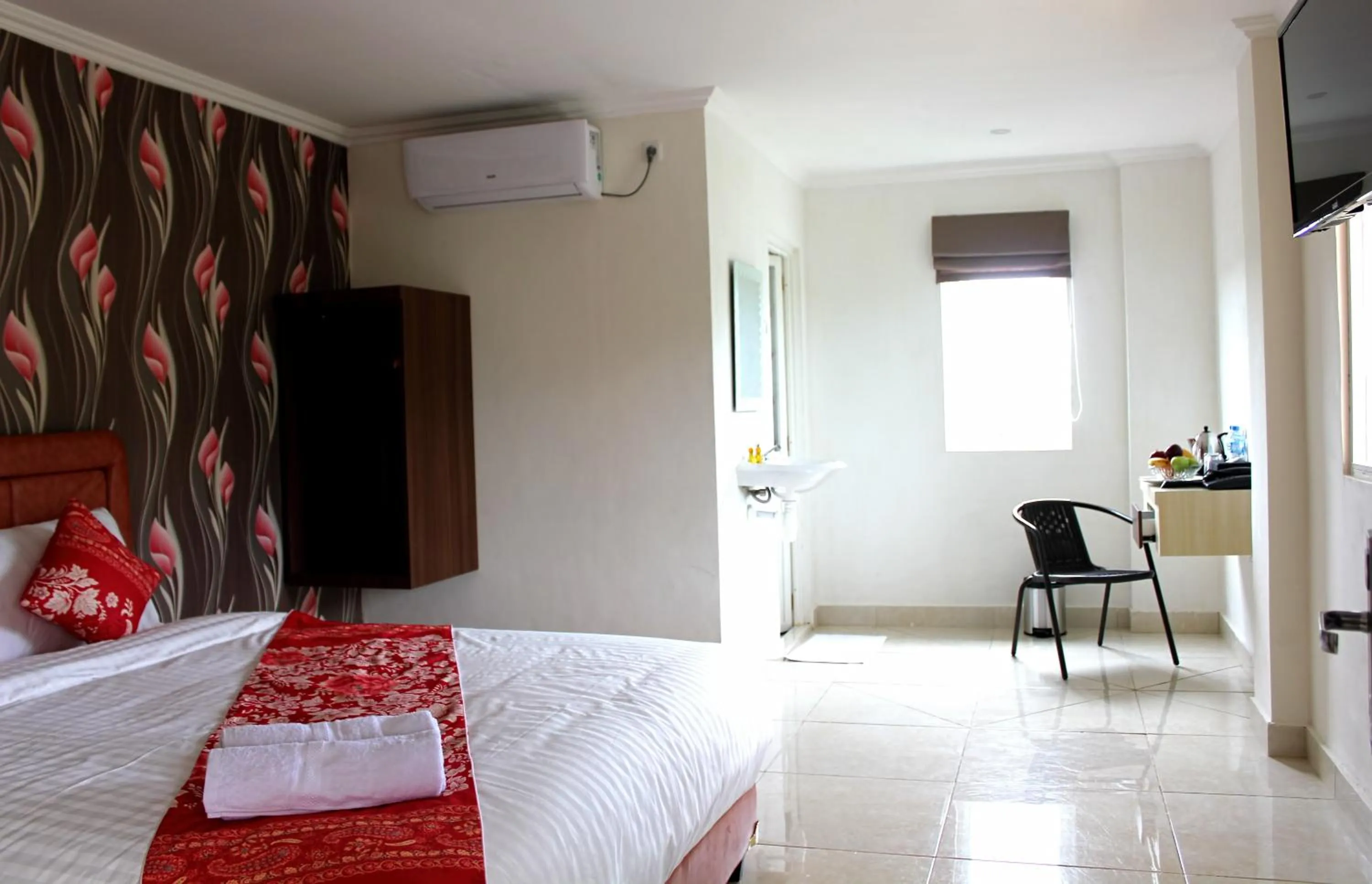 Bed in Mel's Inn Manado