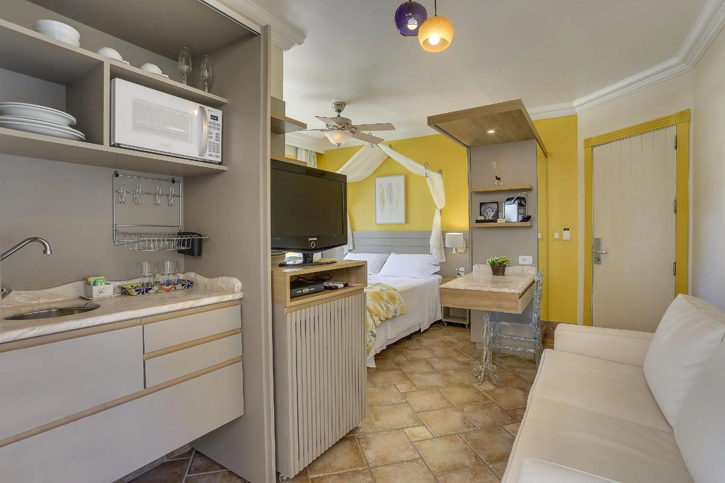 Kitchen or kitchenette in Villas Jurerê Hotel Boutique