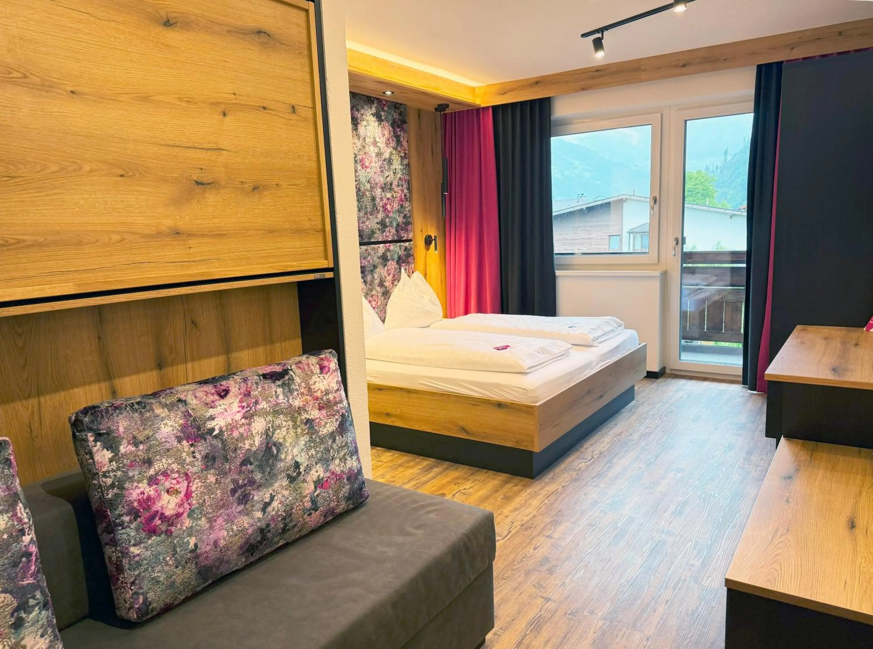 Living room, Bed in first mountain Hotel Zillertal