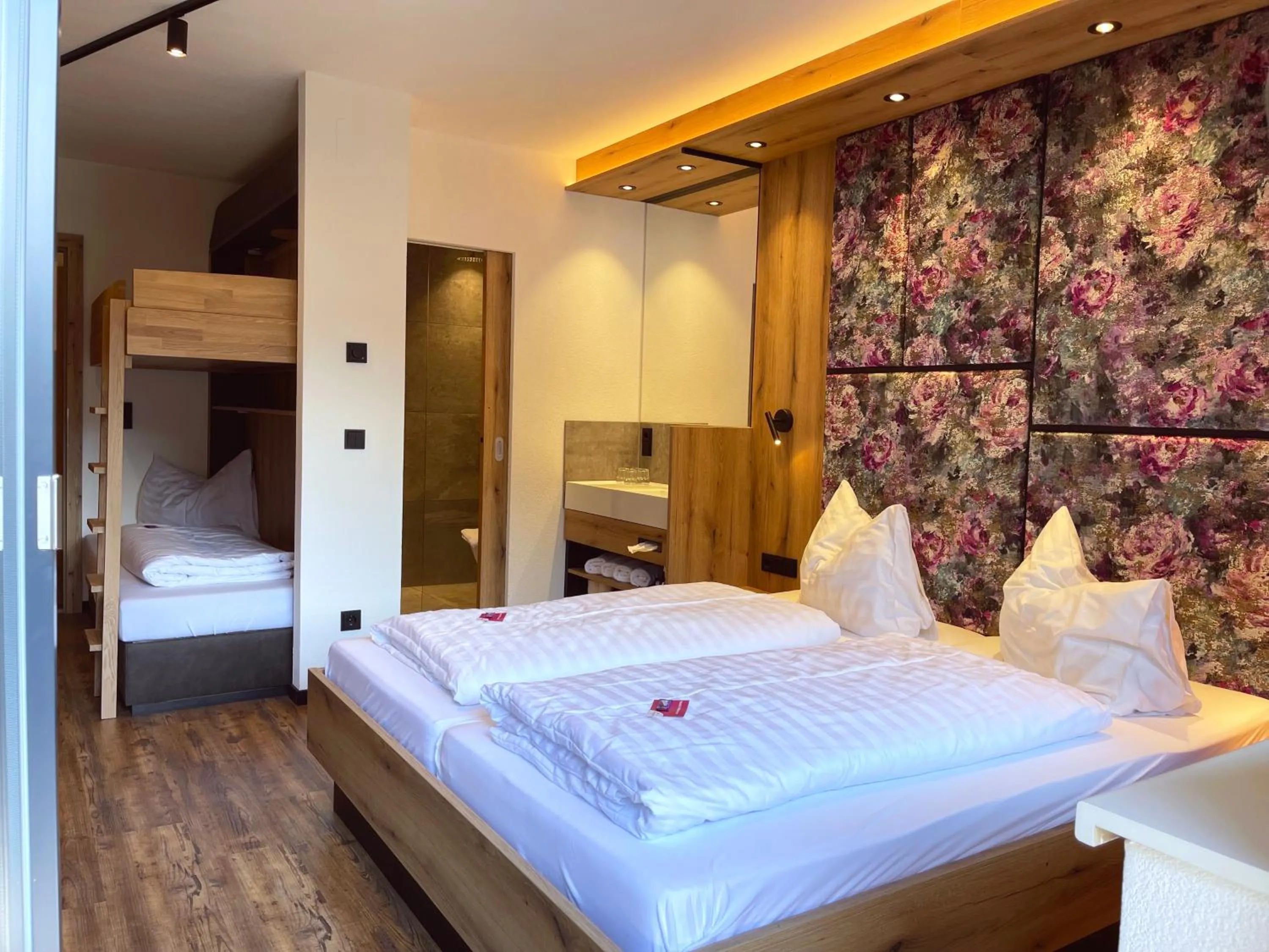 Photo of the whole room, Bed in first mountain Hotel Zillertal