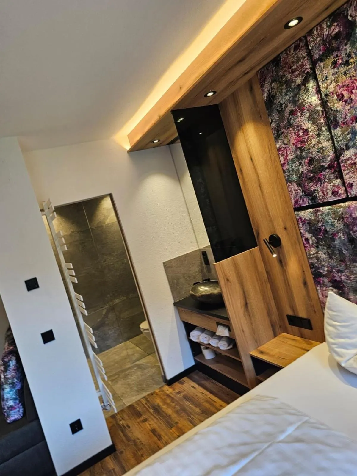 Bathroom, Bed in first mountain Hotel Zillertal