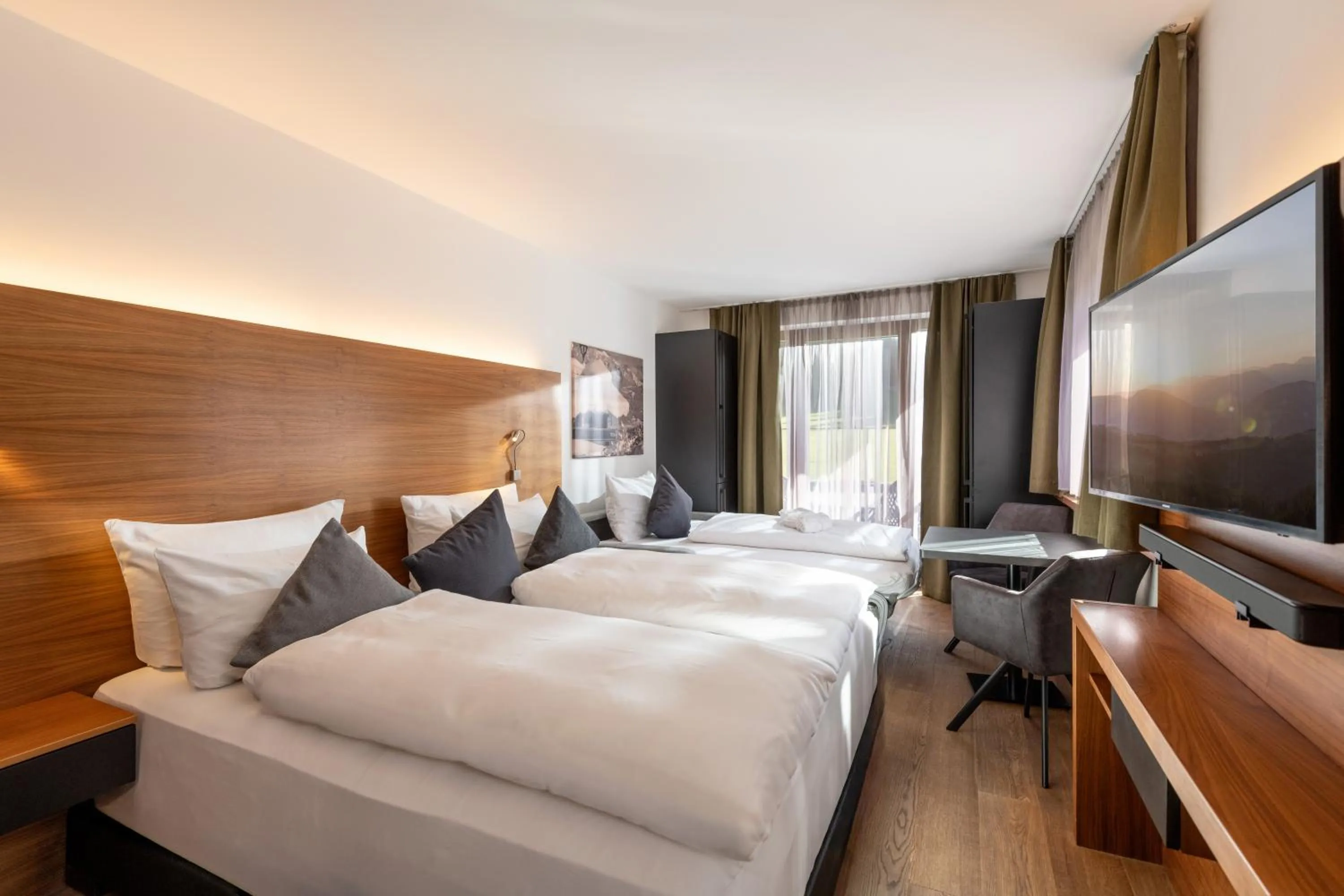 Bed in AlpenParks Hotel & Apartment Taxacher