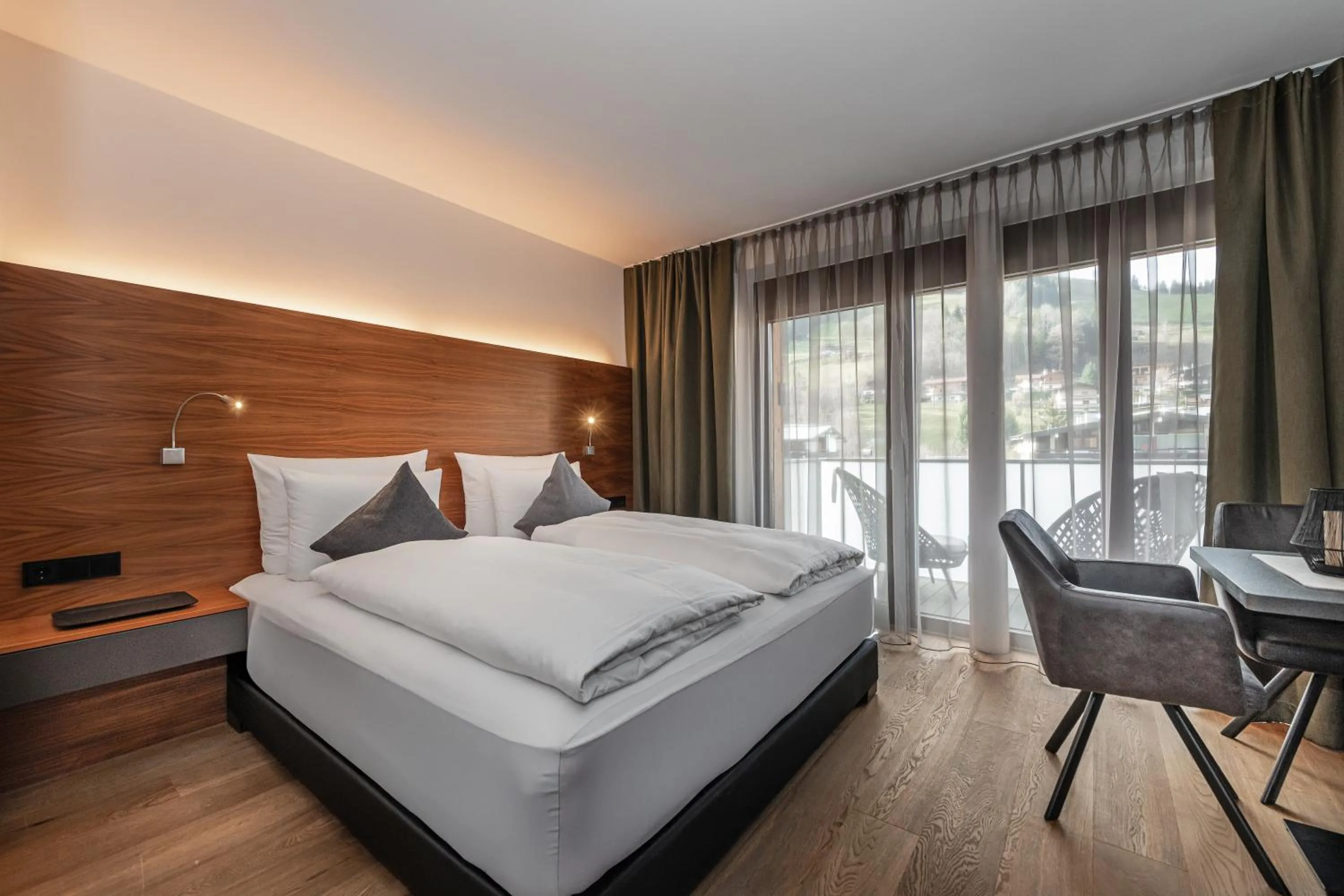 Bedroom, Bed in AlpenParks Hotel & Apartment Taxacher