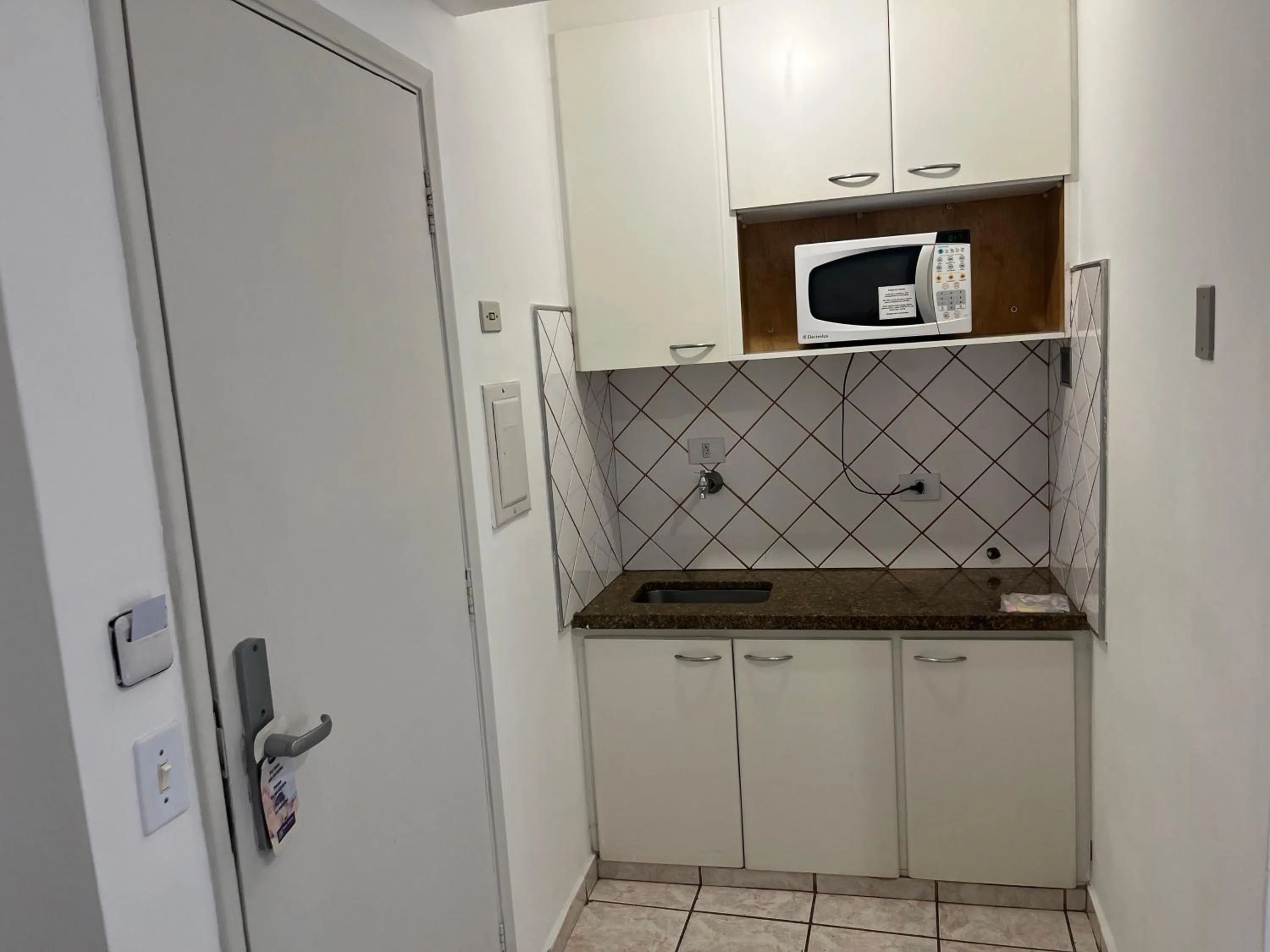 Kitchen or kitchenette in Bela Cintra Flat Service