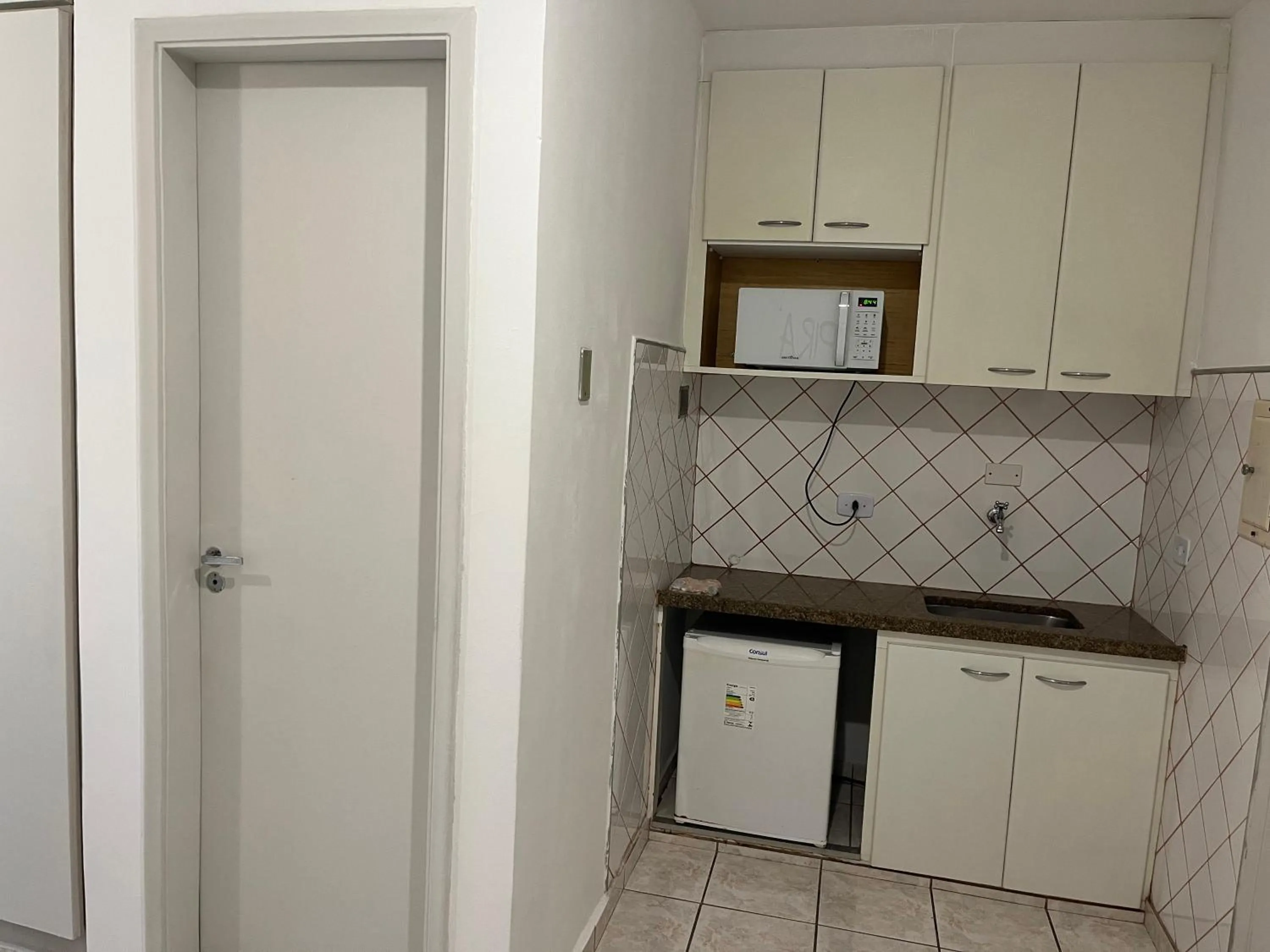 Kitchen or kitchenette in Bela Cintra Flat Service