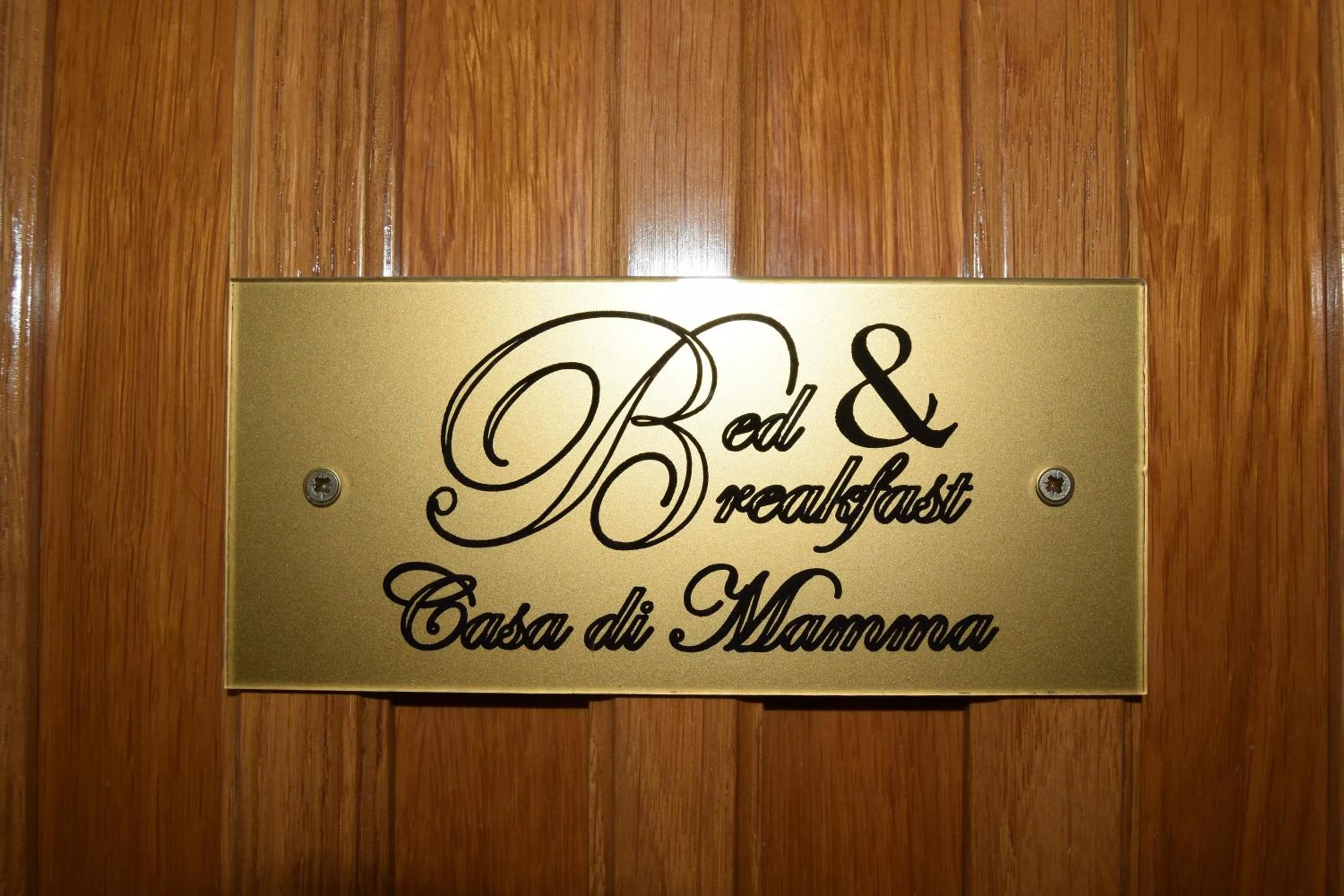 Property logo or sign in B&B Casa di Mamma