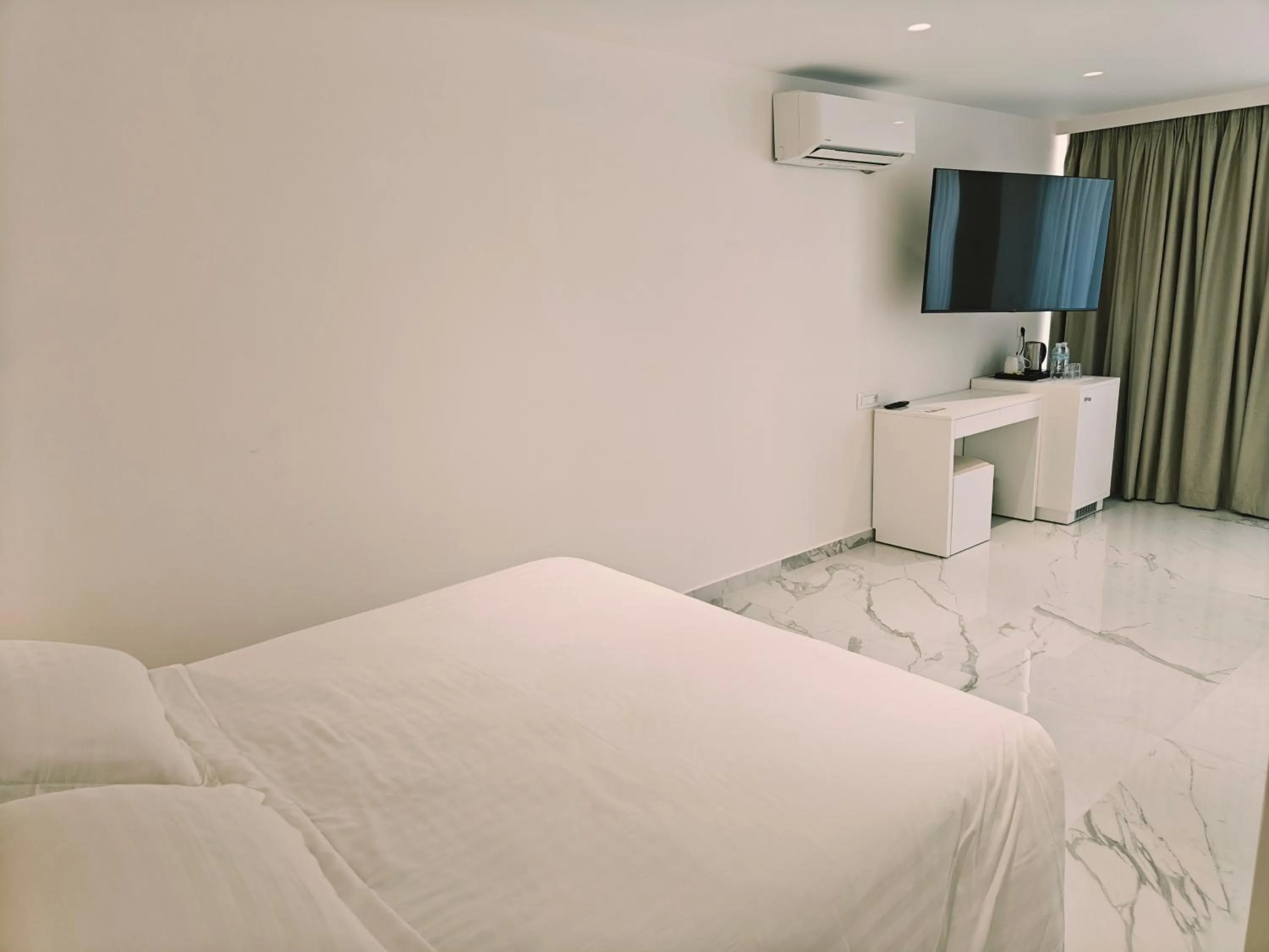 Bed in Ibiscus Hotel