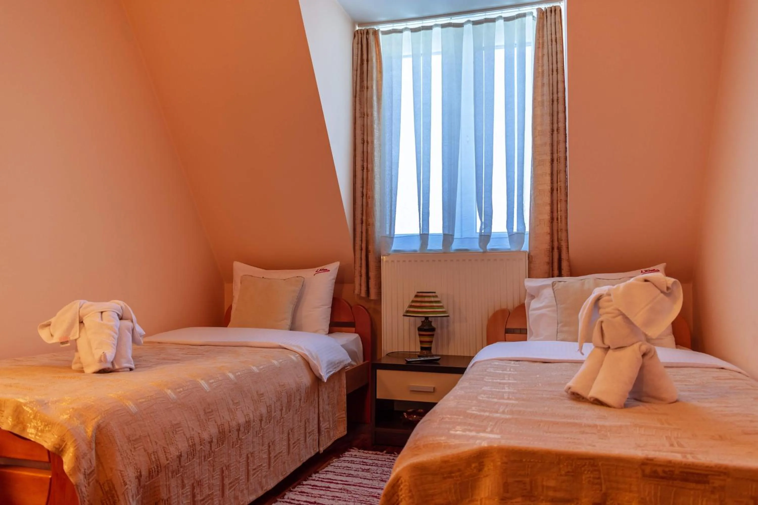 Bed in Garni Hotel Lama