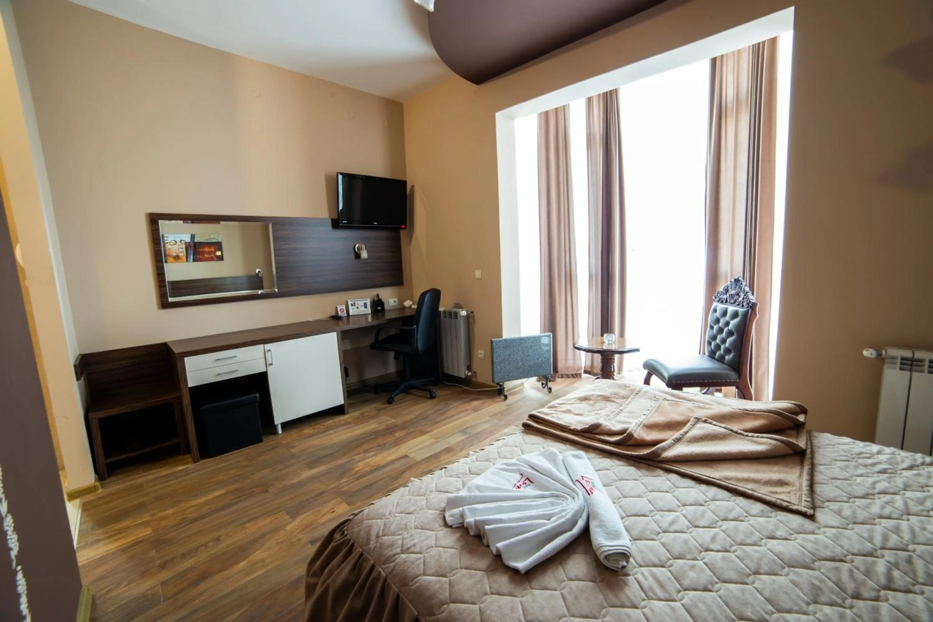 Bed in Garni Hotel Lama