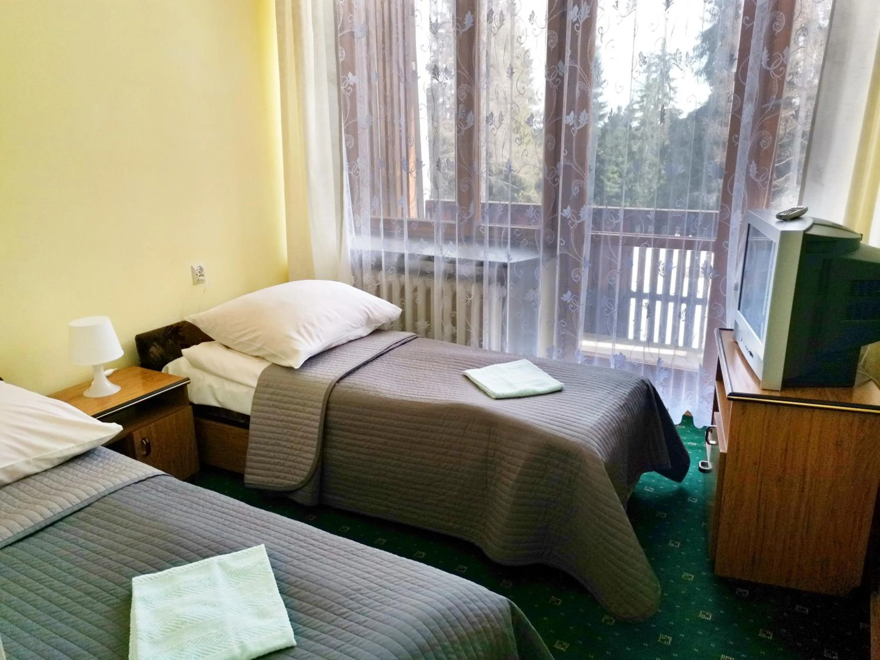 Bed in Zespół Tatry - Hotel Tatry i Budynek Turystyczny