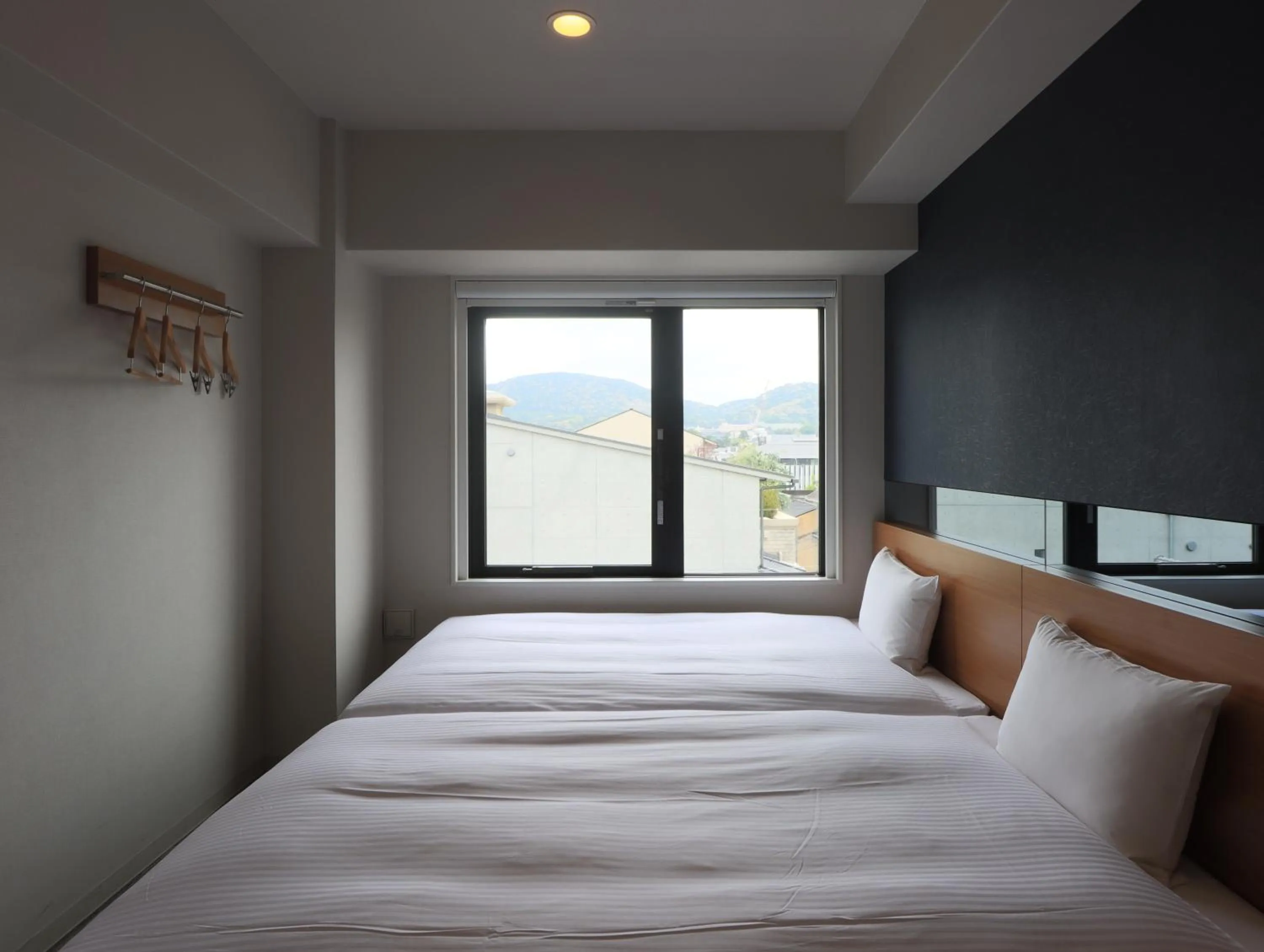 Bed in Hotel Glad One Kyoto Shichijo by M's