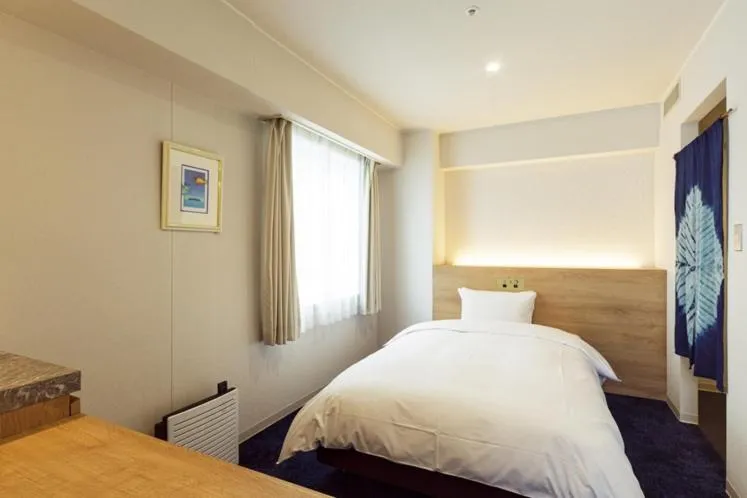 Bed in Awa Kanko Hotel