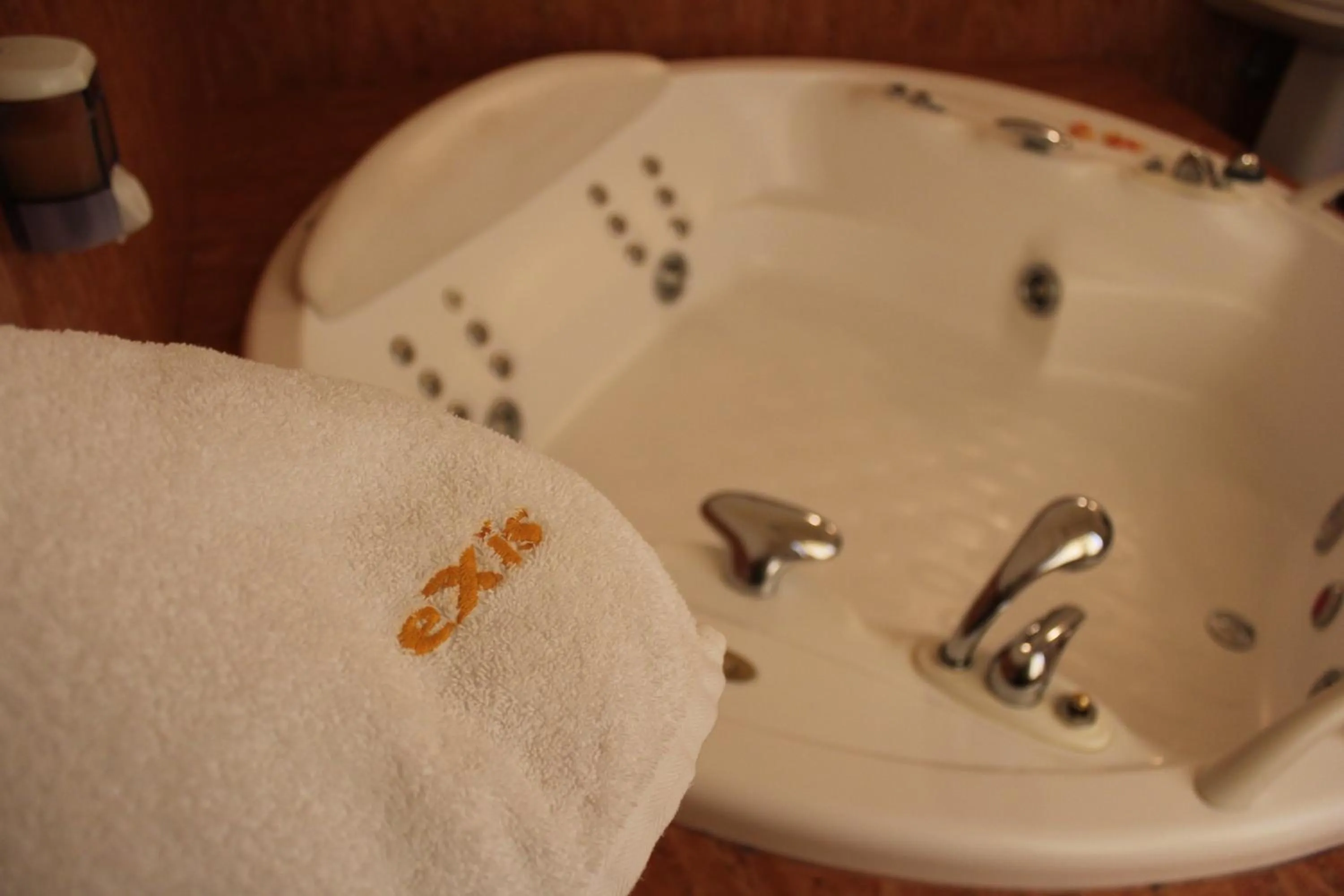 Property logo or sign in Exis Hotel