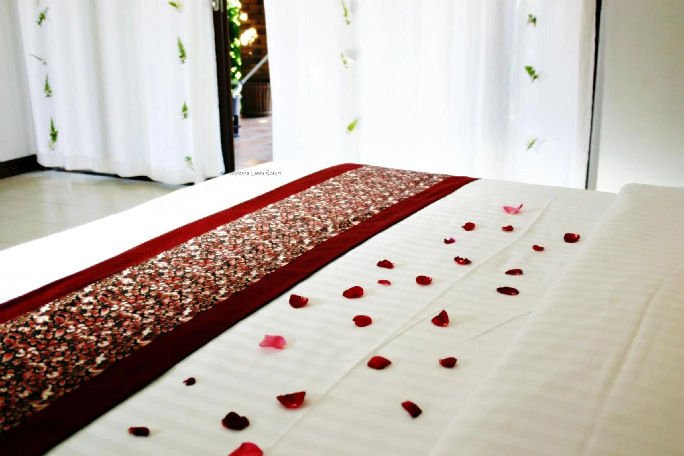 Bed in Tropicana Lanta Resort