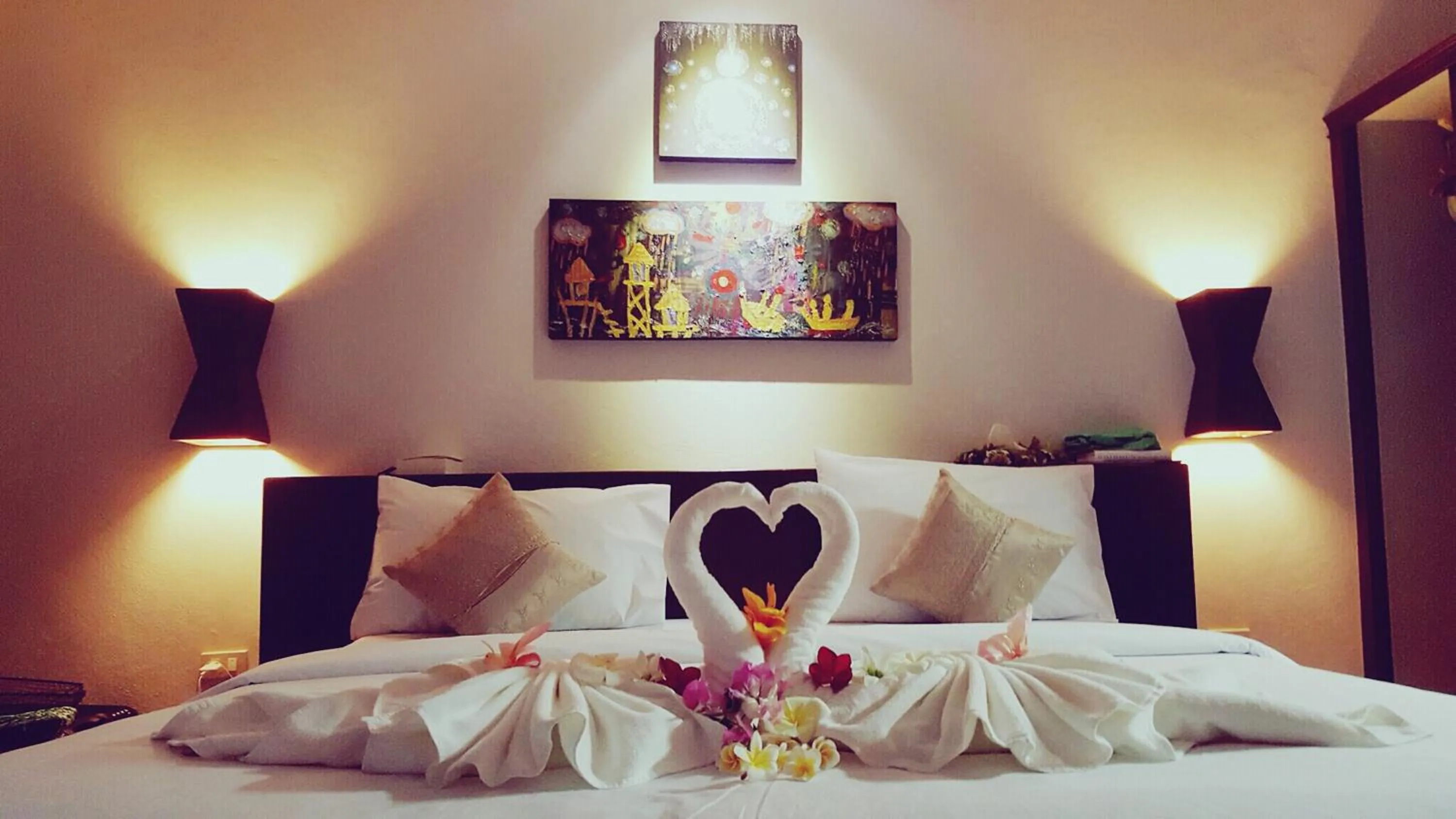 Bed in Tropicana Lanta Resort