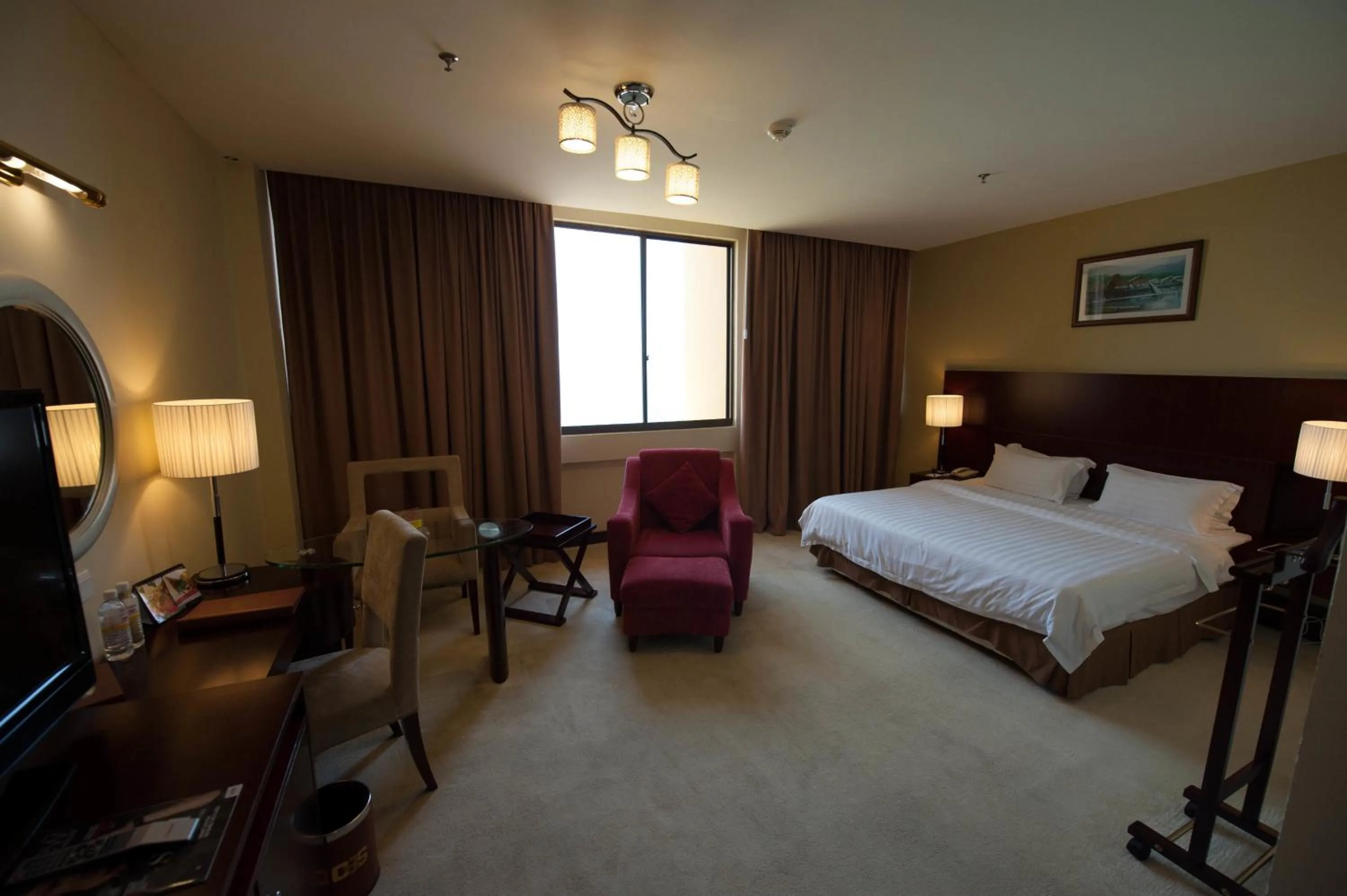 Living room, Bed in Gaya Centre Hotel