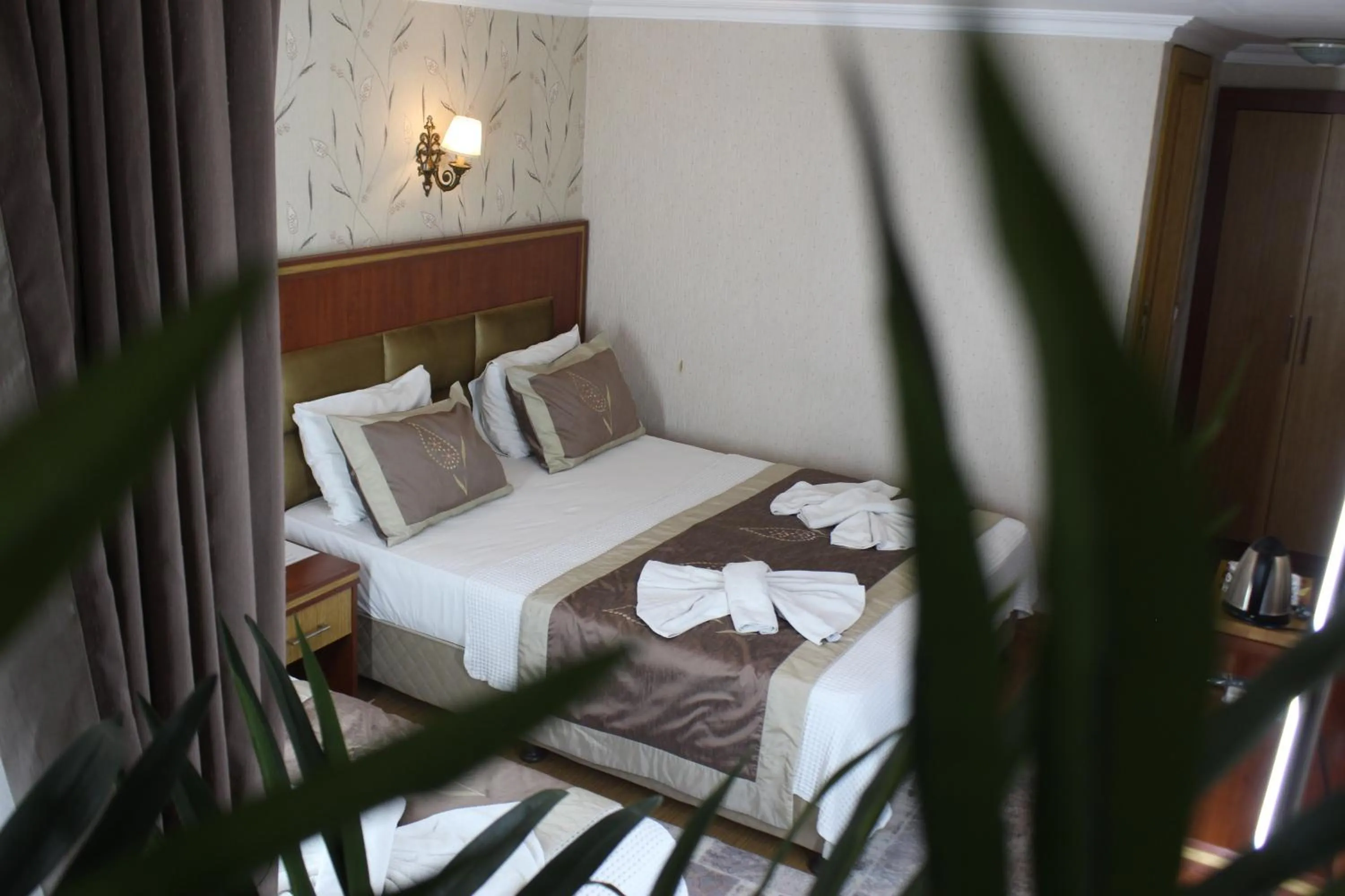 Bed in Hermanos Hotel