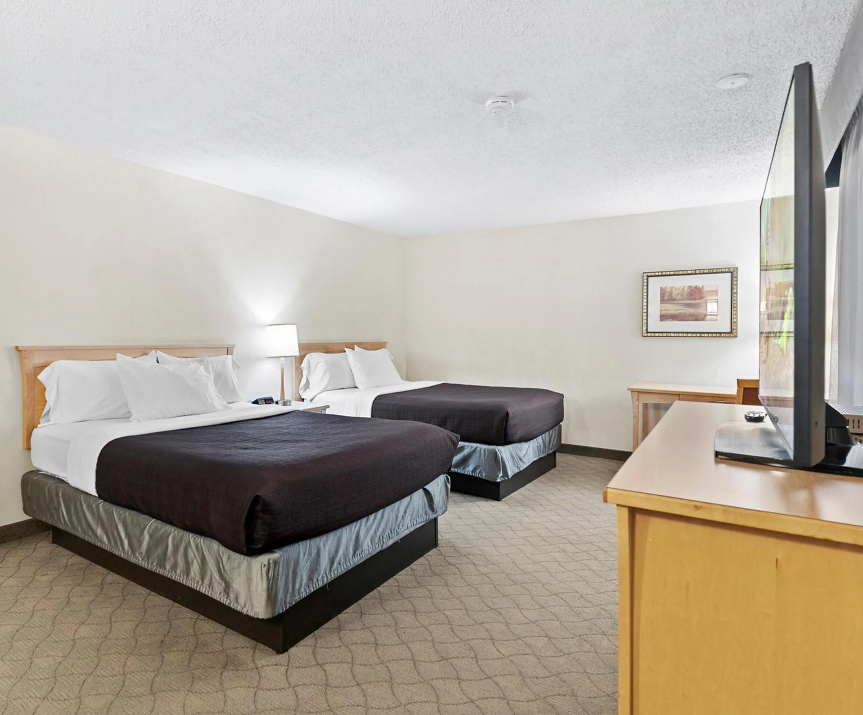 Bedroom, Bed in Travelodge Hotel by Wyndham Saskatoon