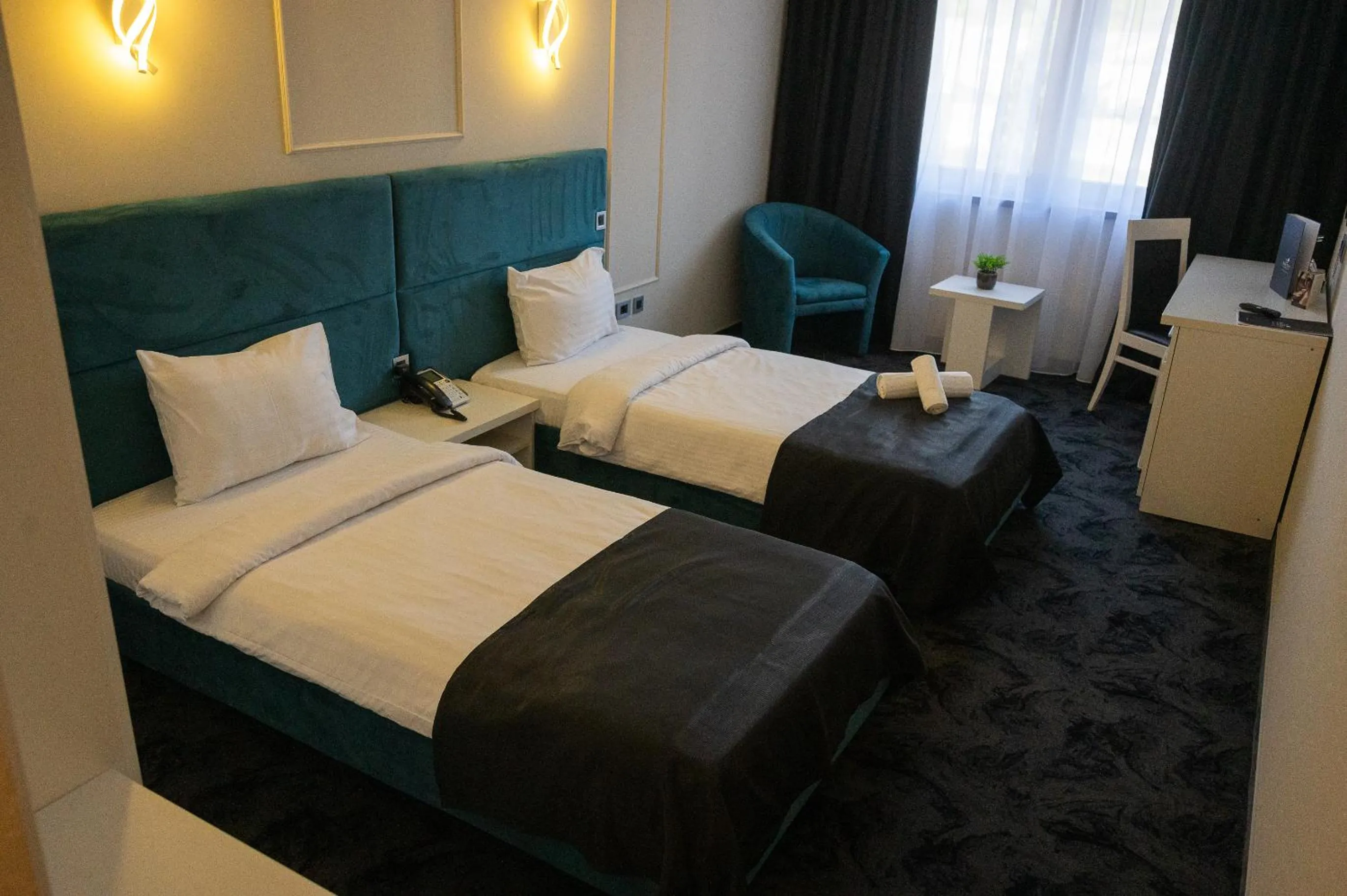 Bed in Black Tulip Hotel