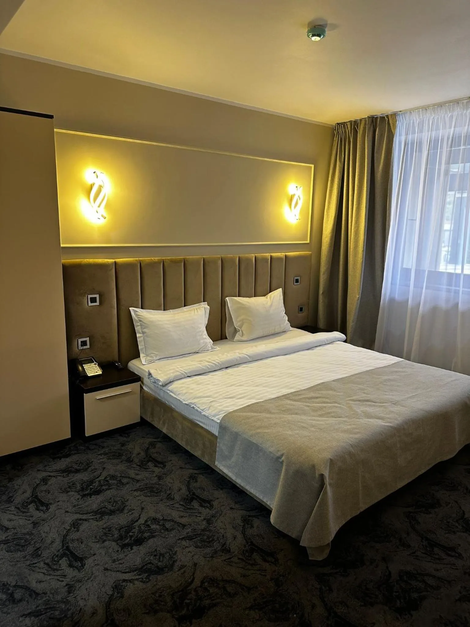 Bed in Black Tulip Hotel