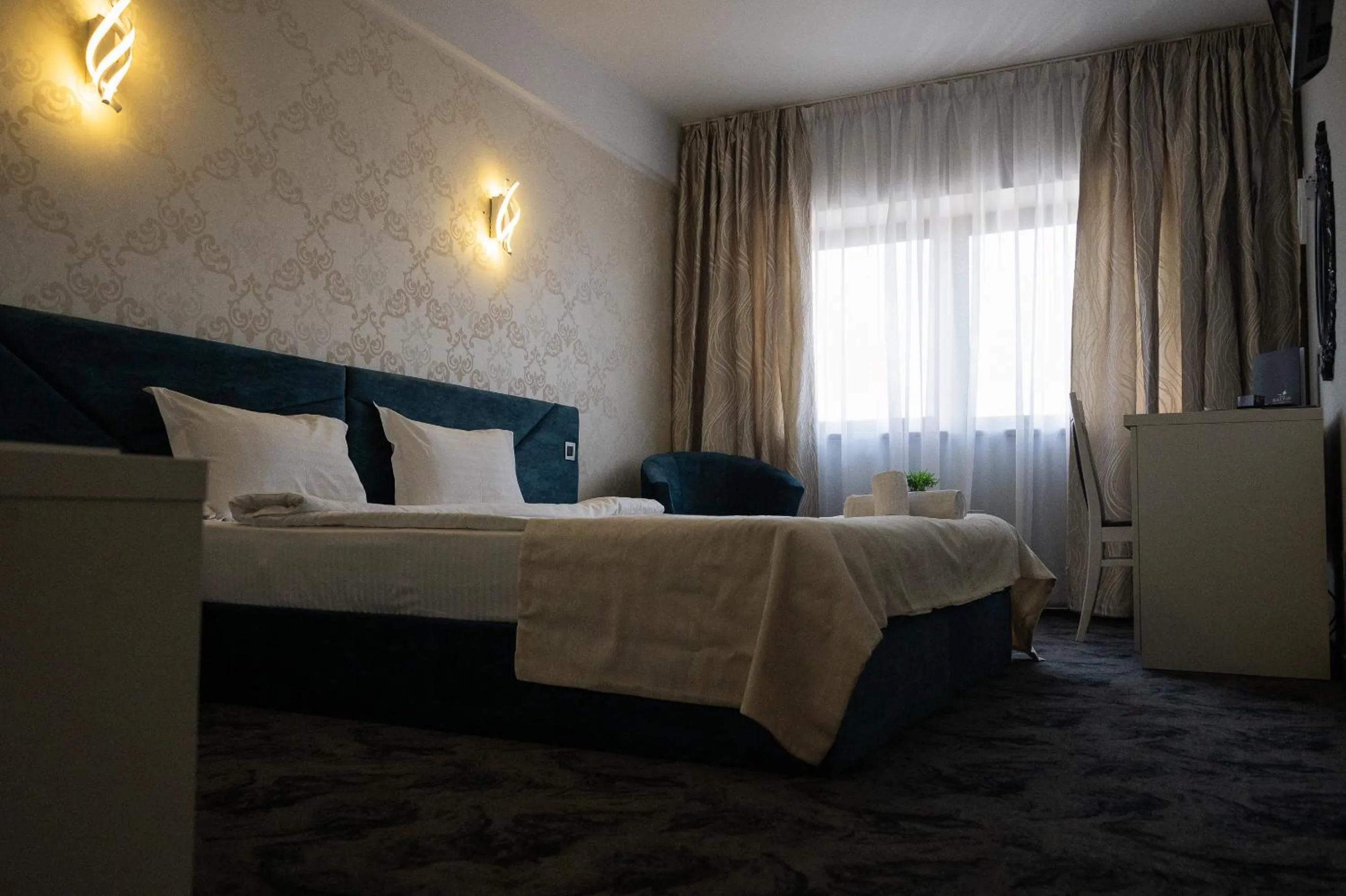 Bed in Black Tulip Hotel