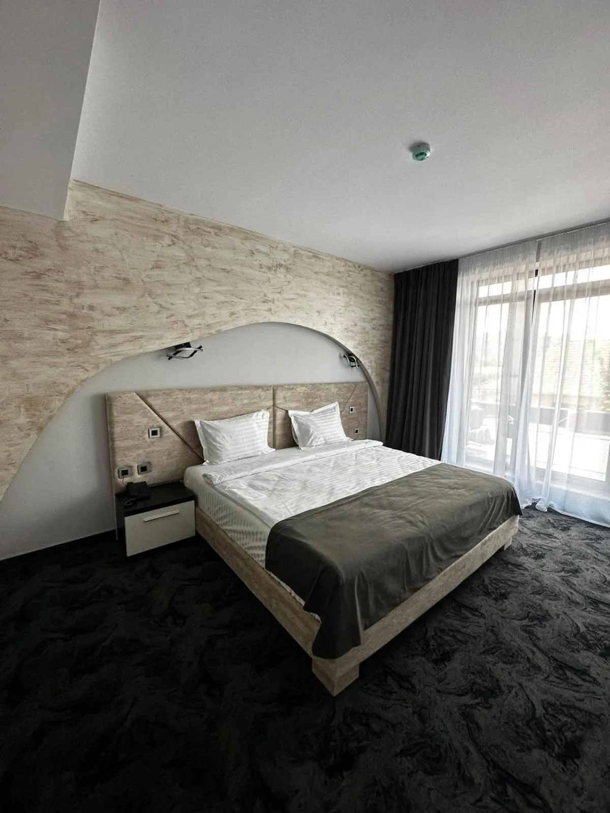 Bed in Black Tulip Hotel