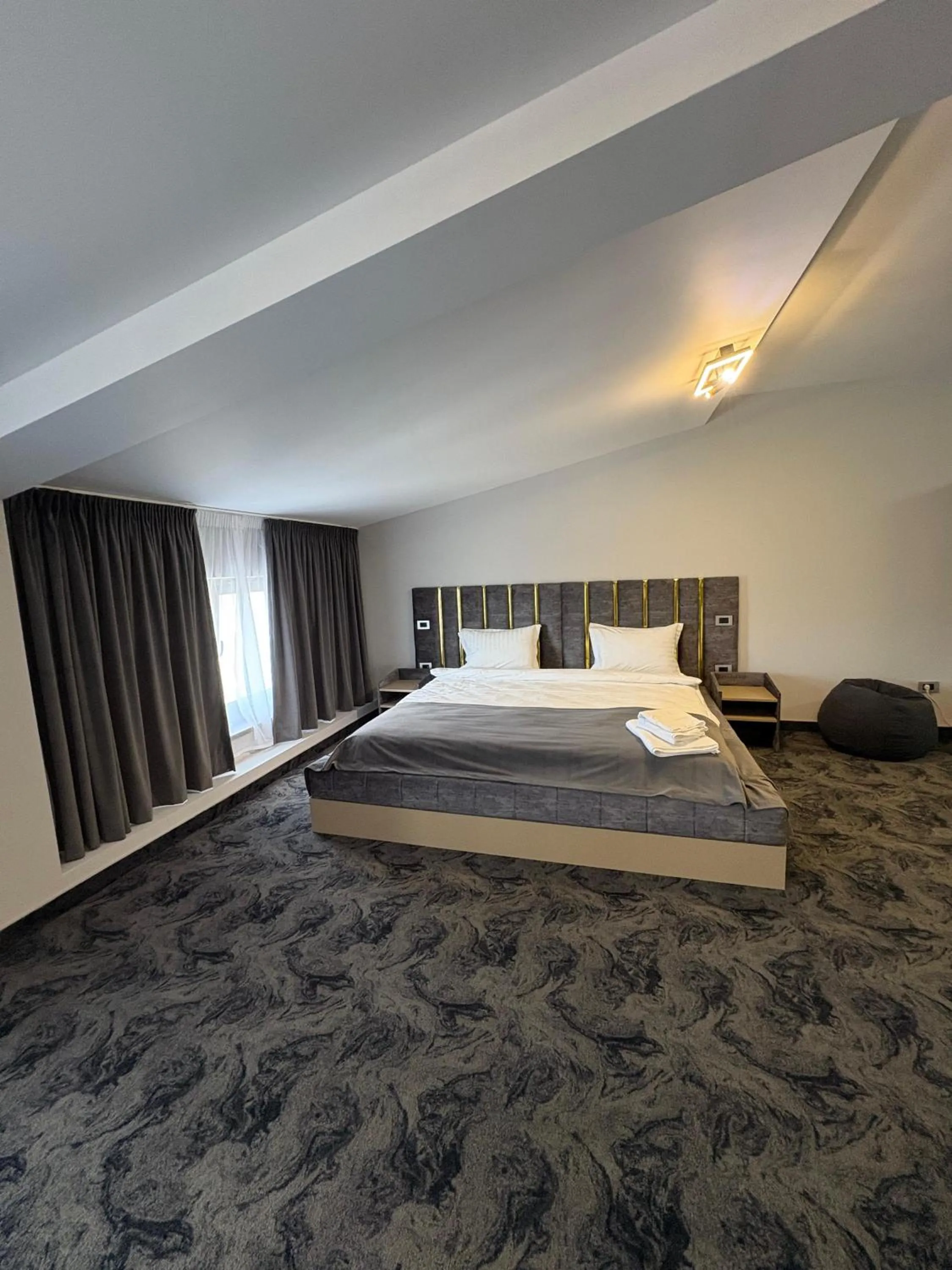 Bed in Black Tulip Hotel