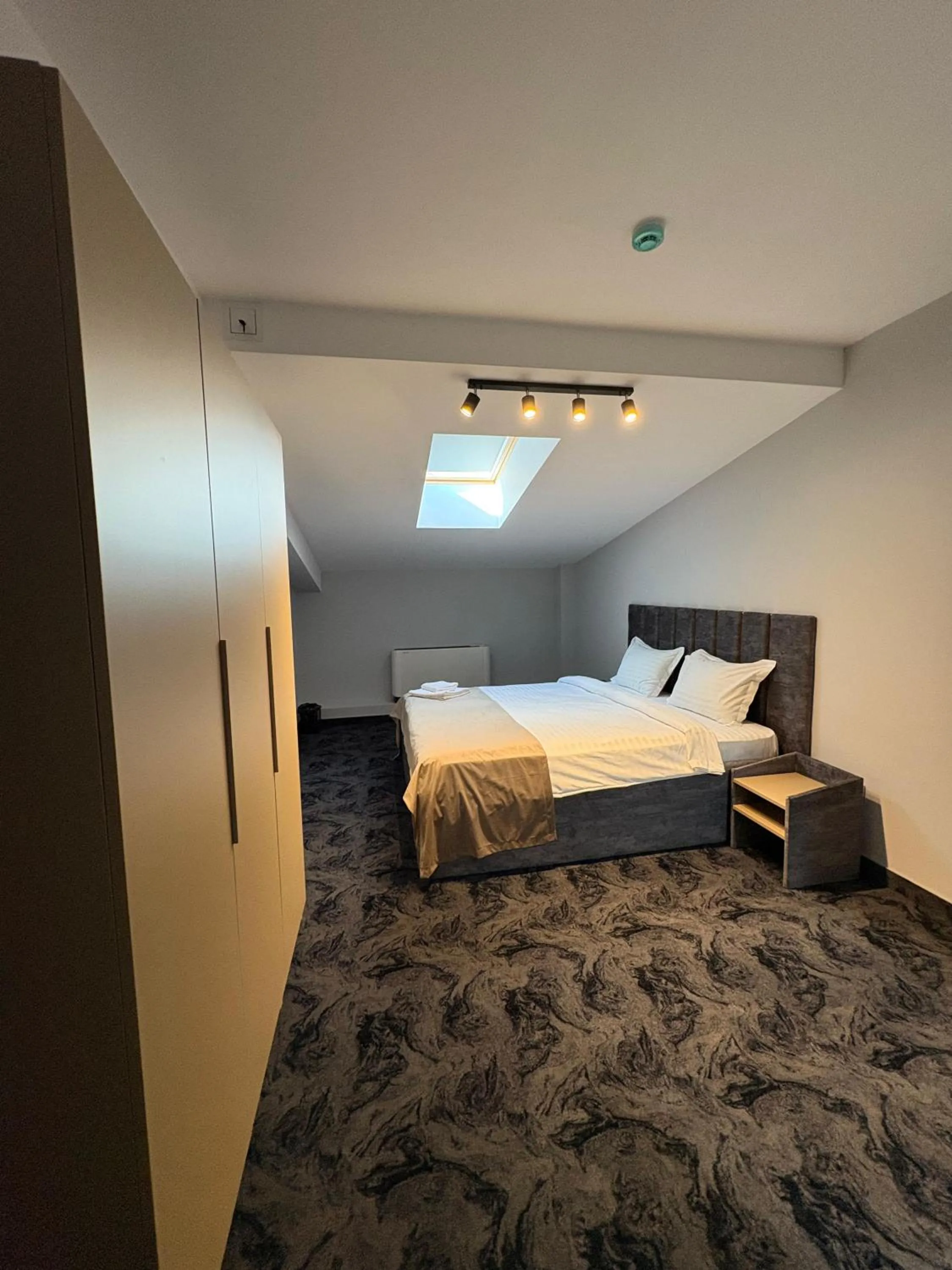 Bed in Black Tulip Hotel