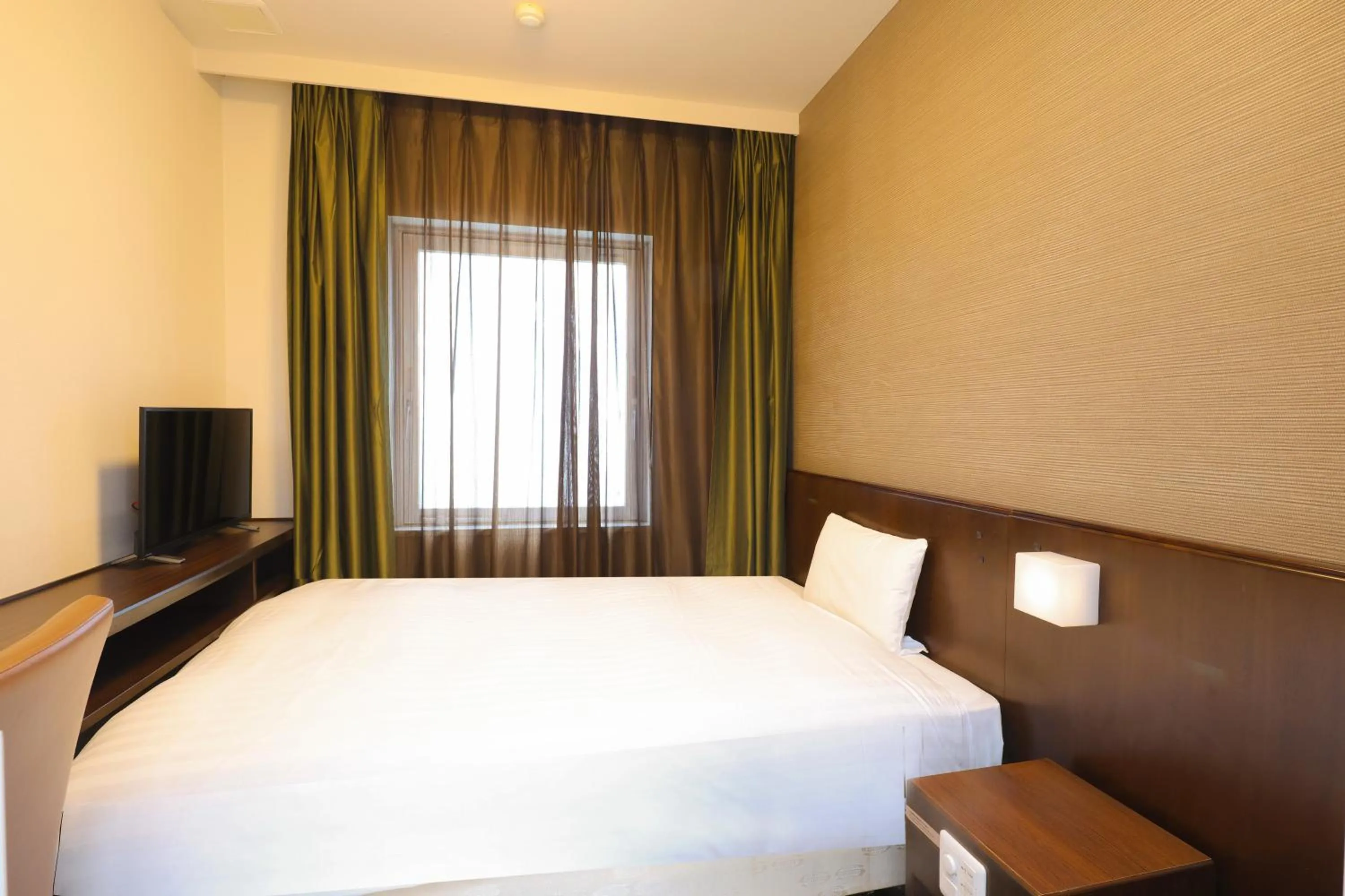 Bed in Dormy Inn Matsumoto