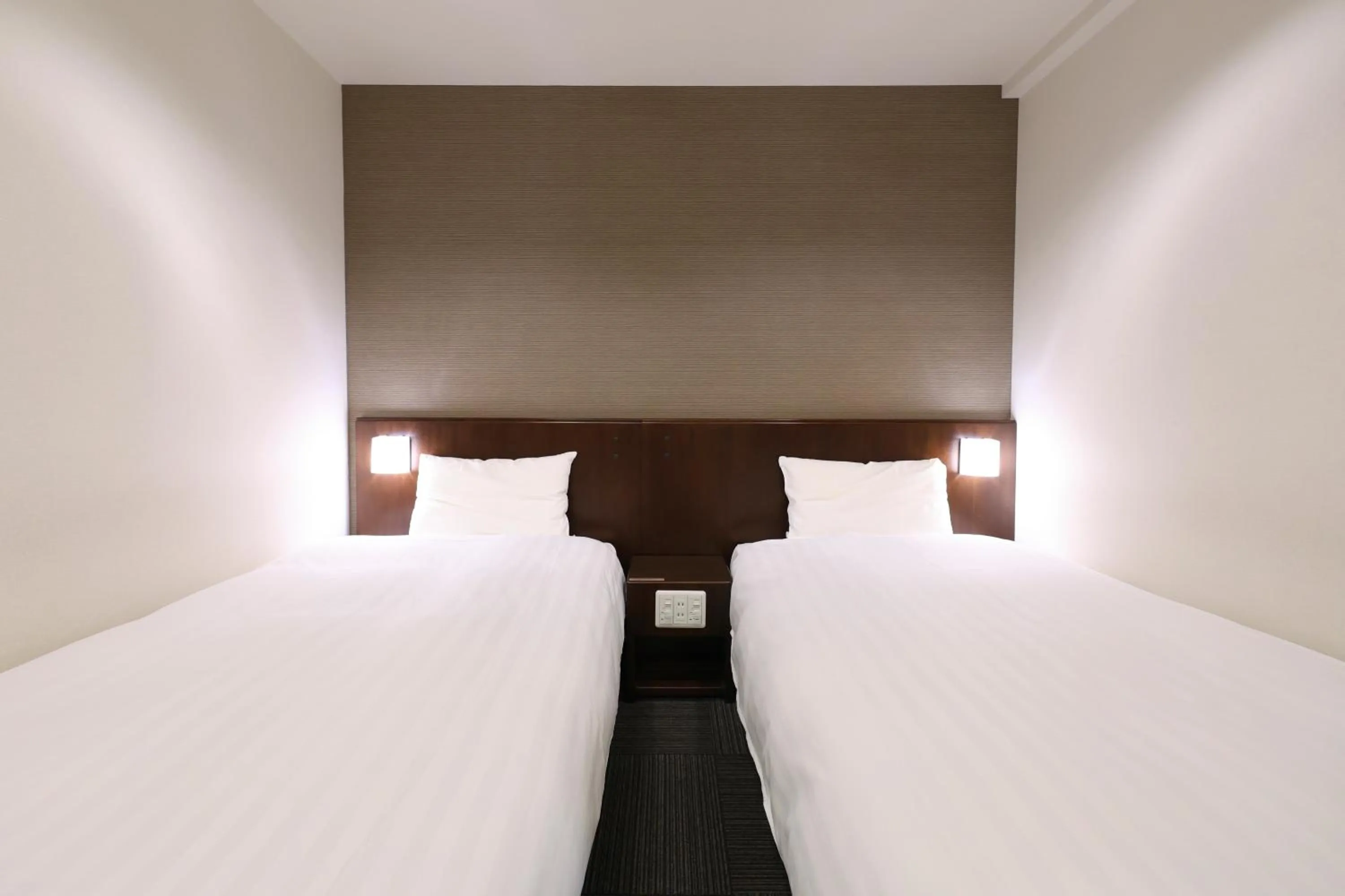 Bed in Dormy Inn Matsumoto