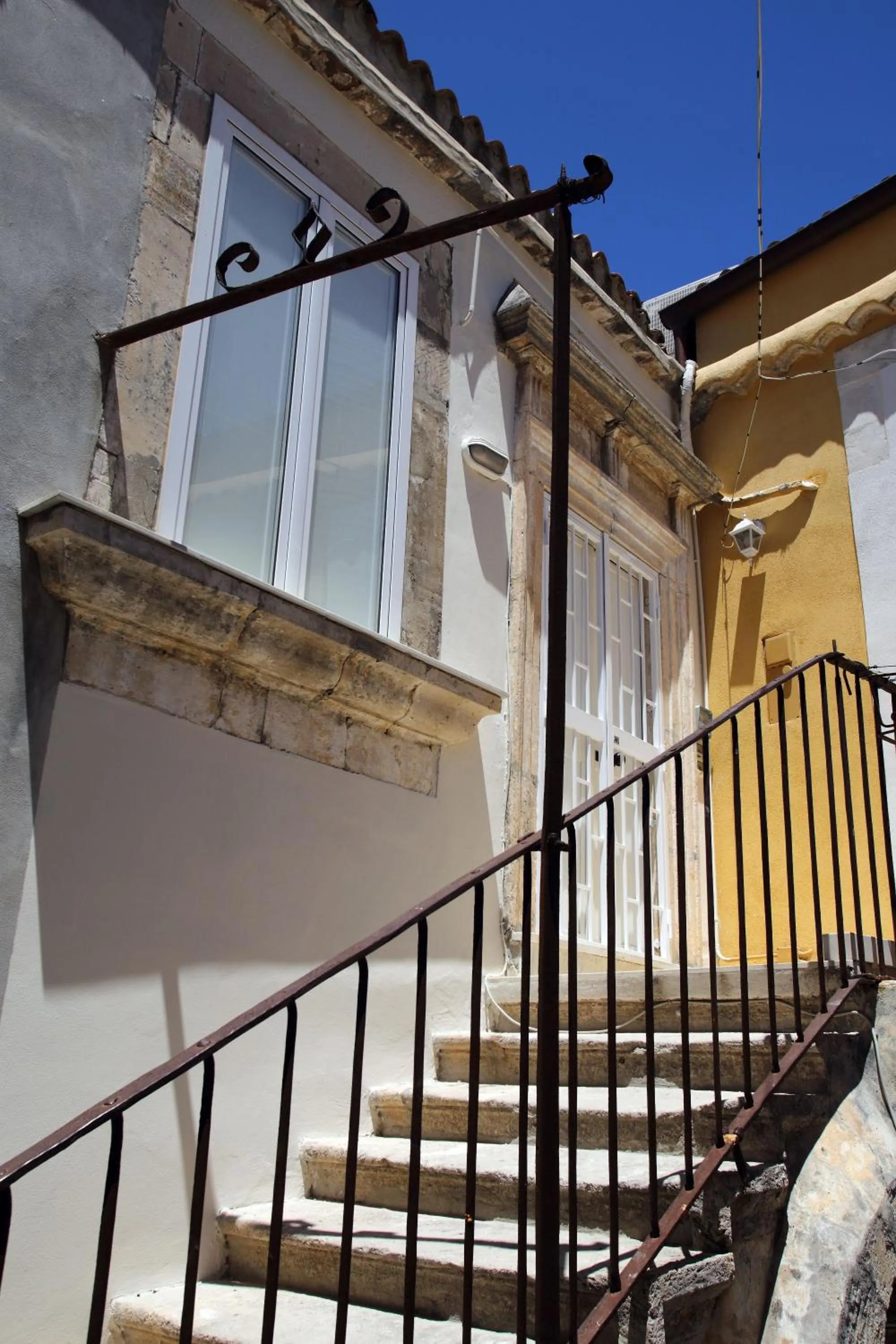 Property building in Avolio Tailored Rooms