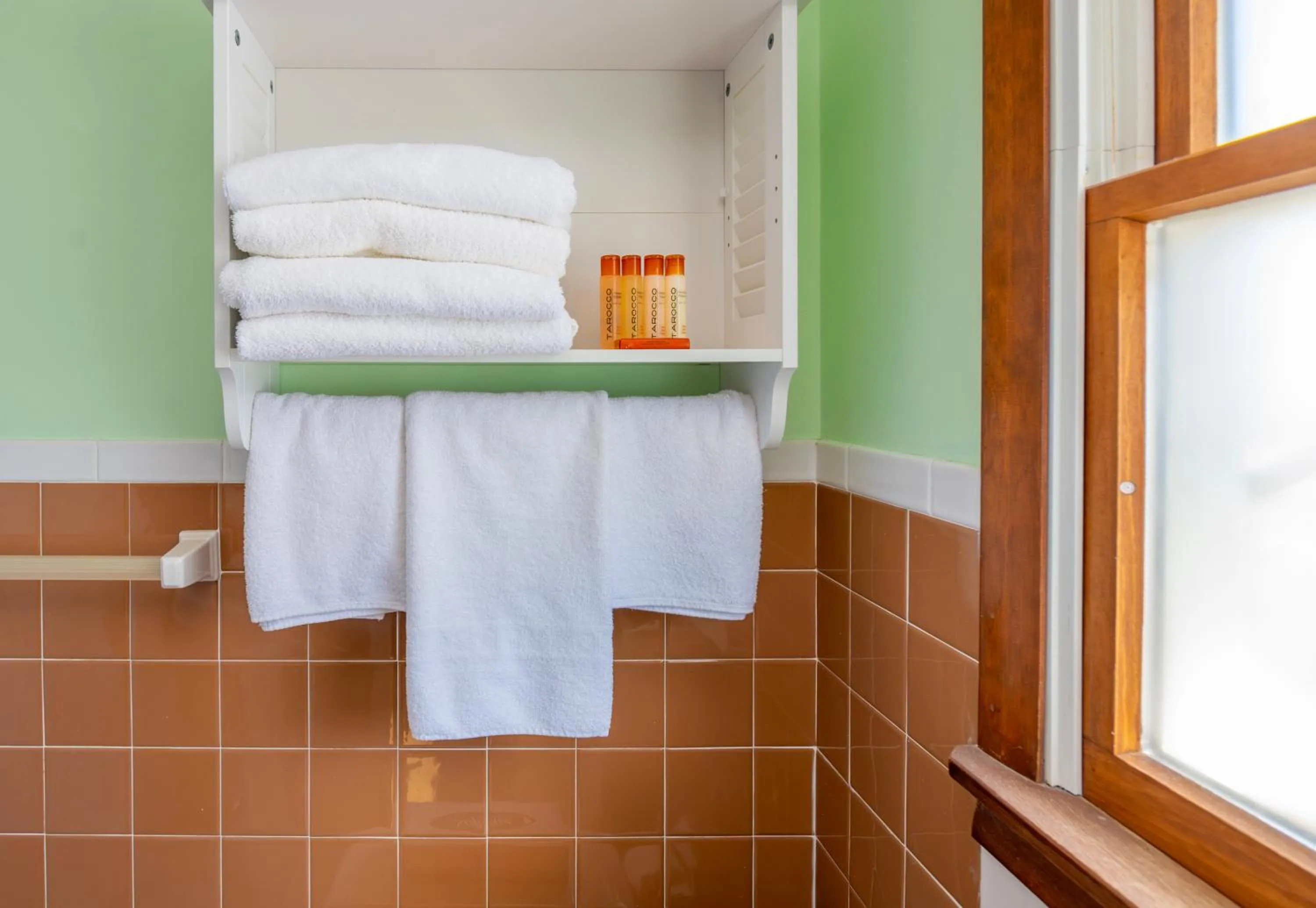 Bathroom, Bed in Drifting Sands Oceanfront Hotel