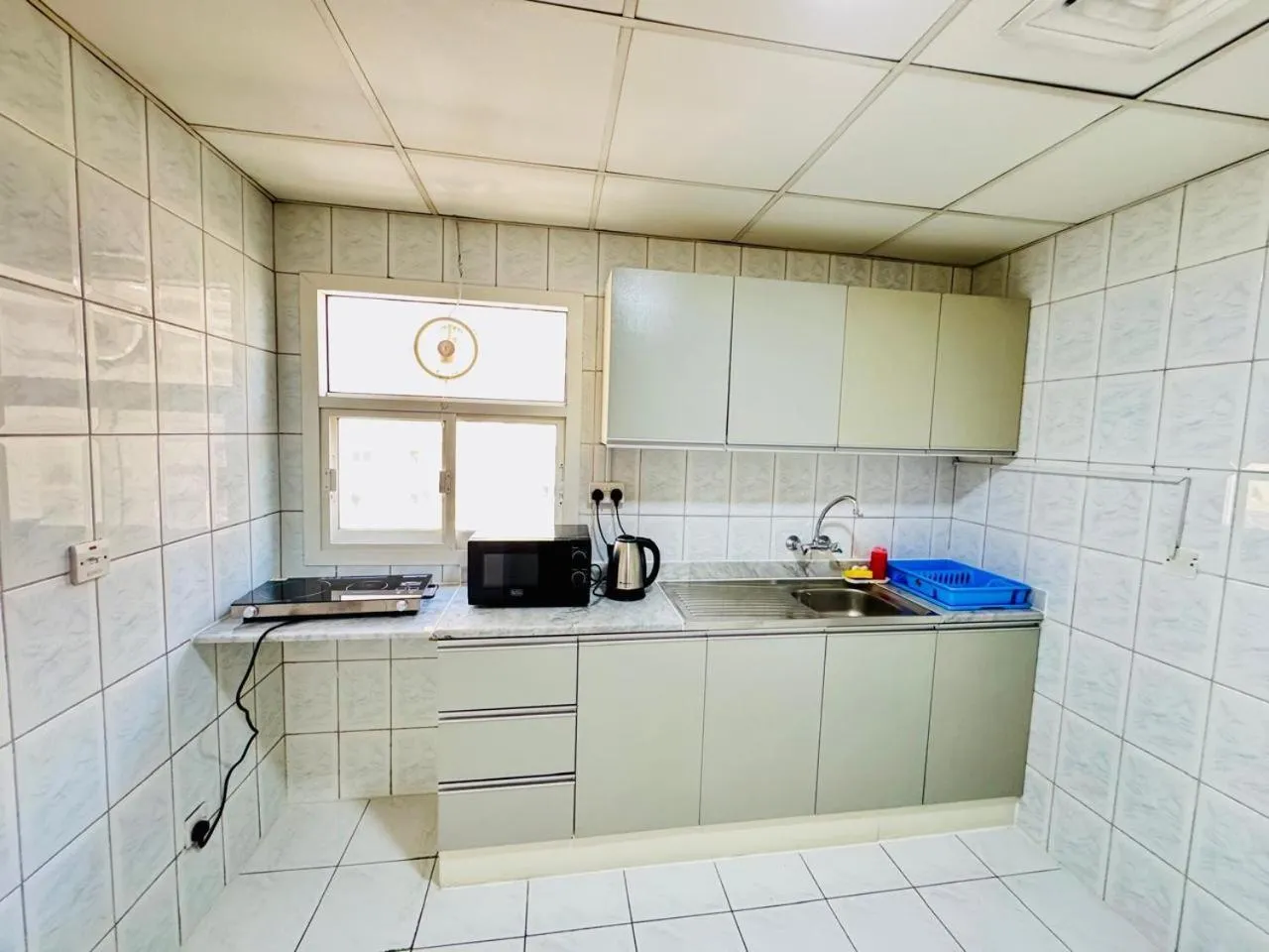 Kitchen or kitchenette in Basma Residence Hotel Apartments