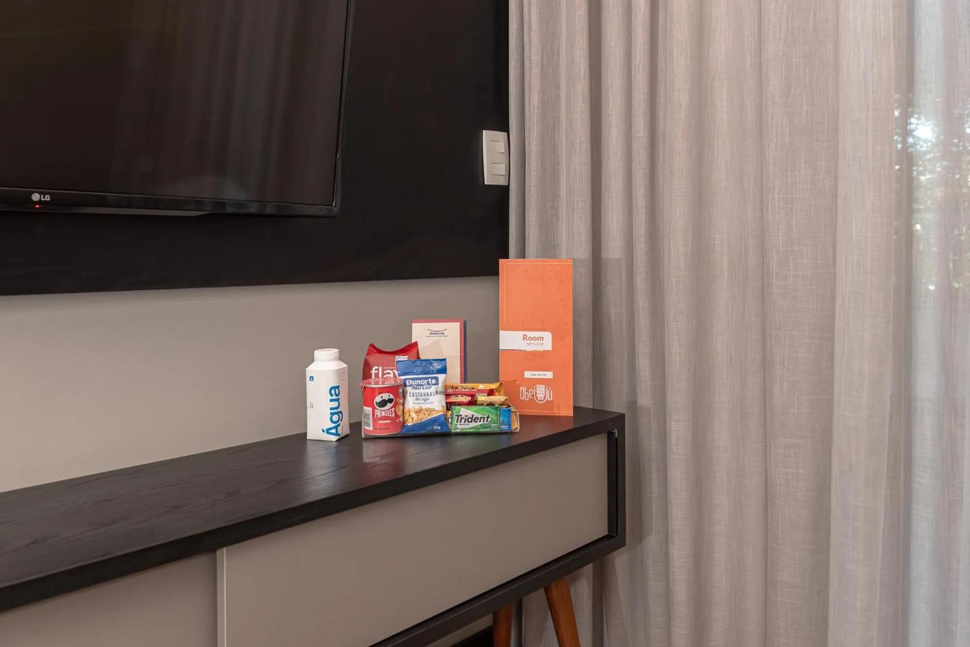 Living room in I am Design Hotel Campinas by Hotelaria Brasil