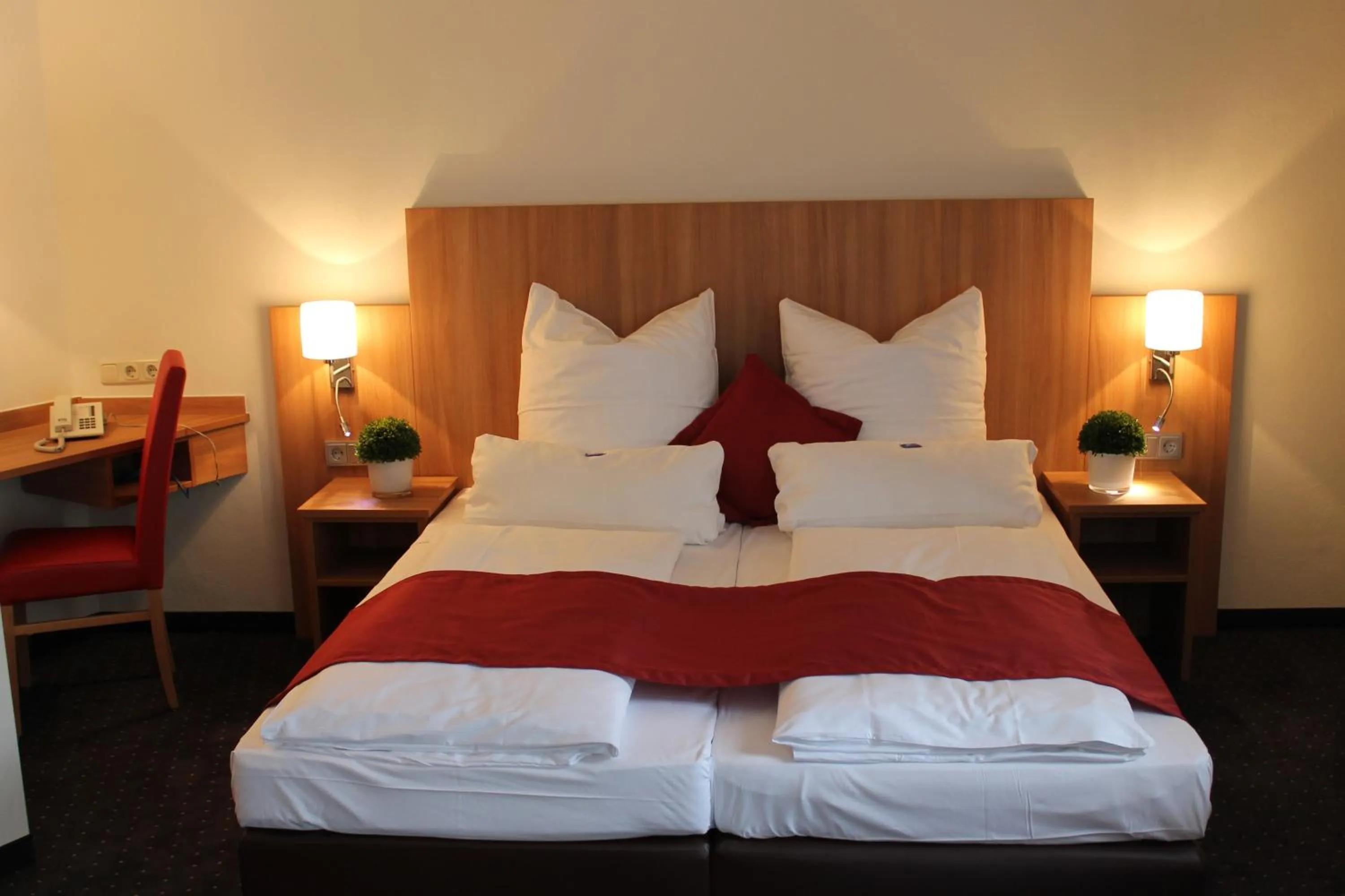 Bed in Ambassador Apparthotel