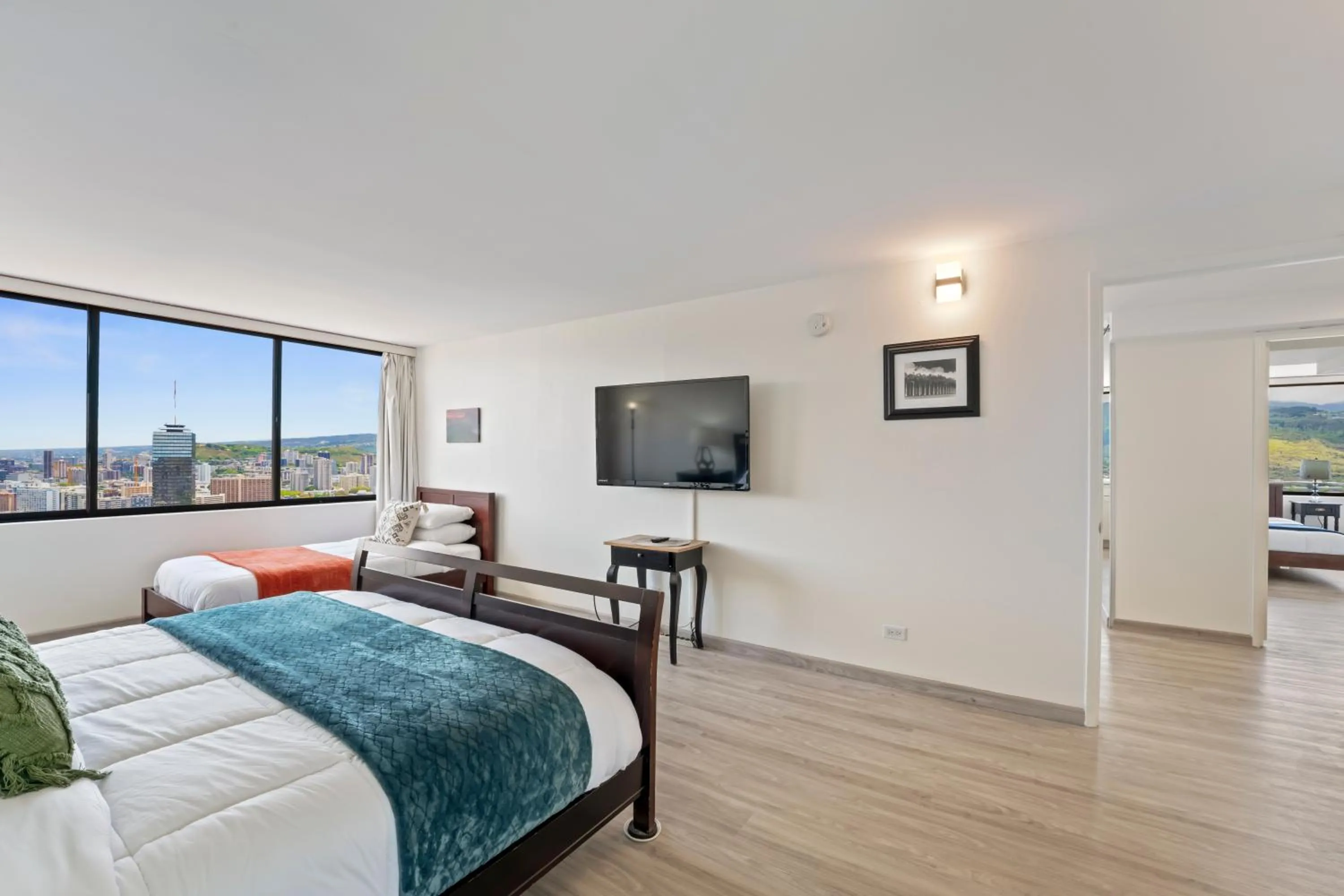 Bed in Hawaiian Monarch Penthouse 104 by Hawaii Ocean Club