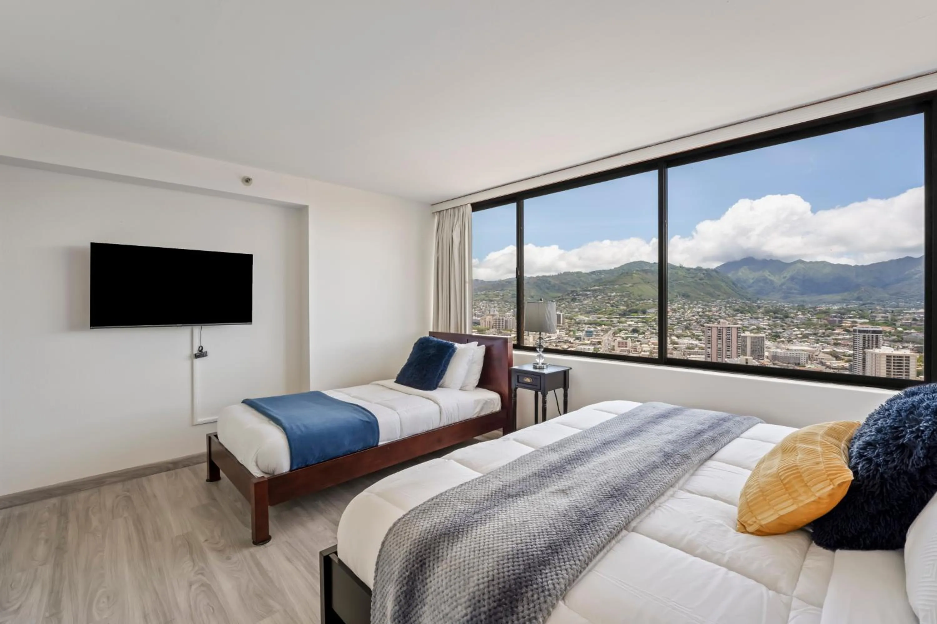 Bed in Hawaiian Monarch Penthouse 104 by Hawaii Ocean Club