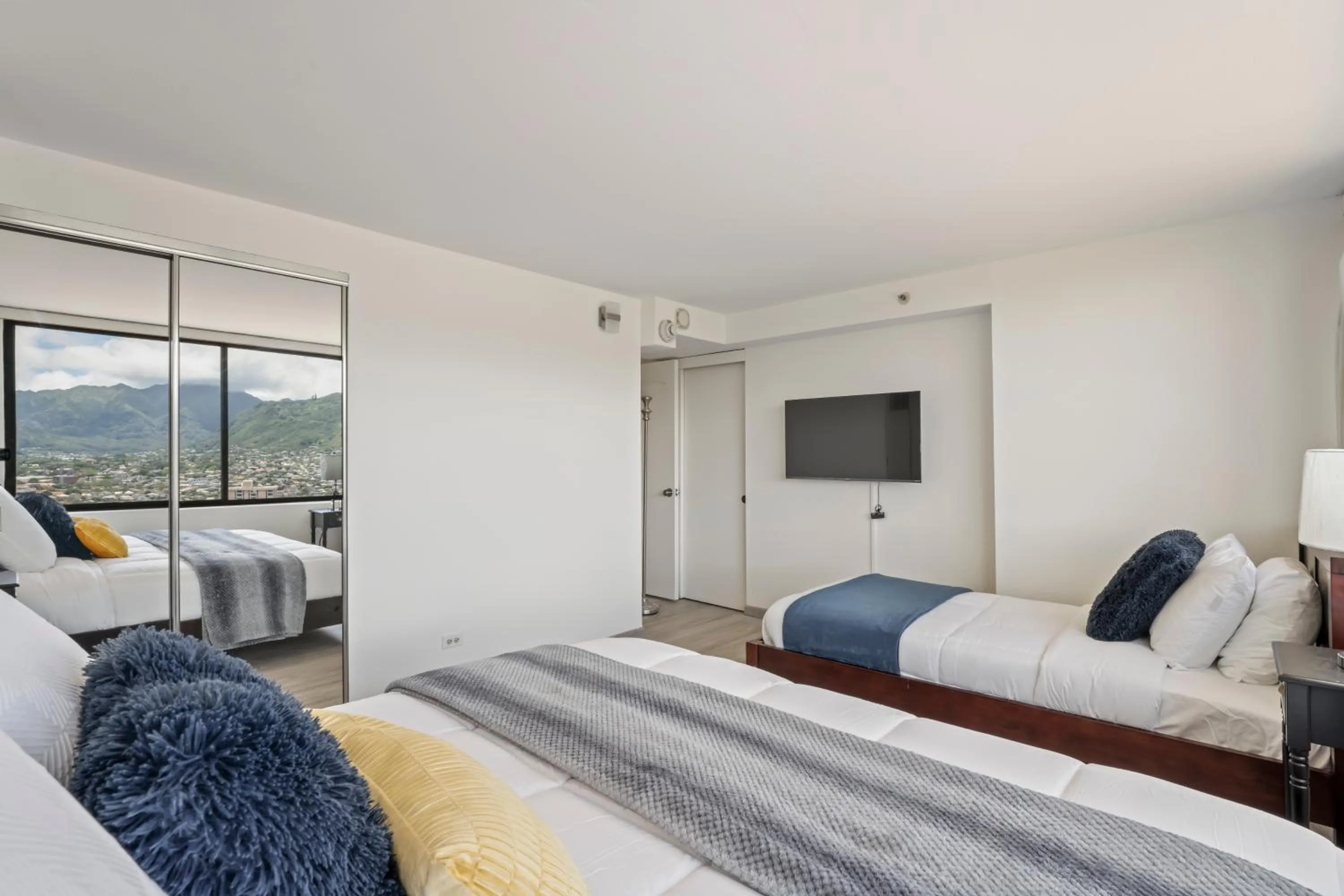 Bed in Hawaiian Monarch Penthouse 104 by Hawaii Ocean Club