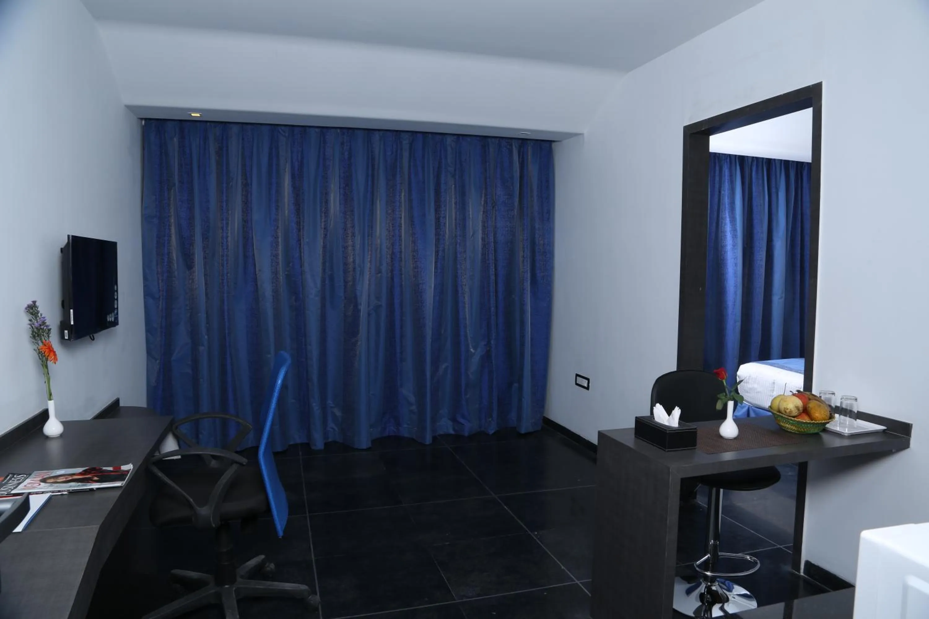 TV and multimedia in Days Inn & Suites by Wyndham Bengaluru Whitefield