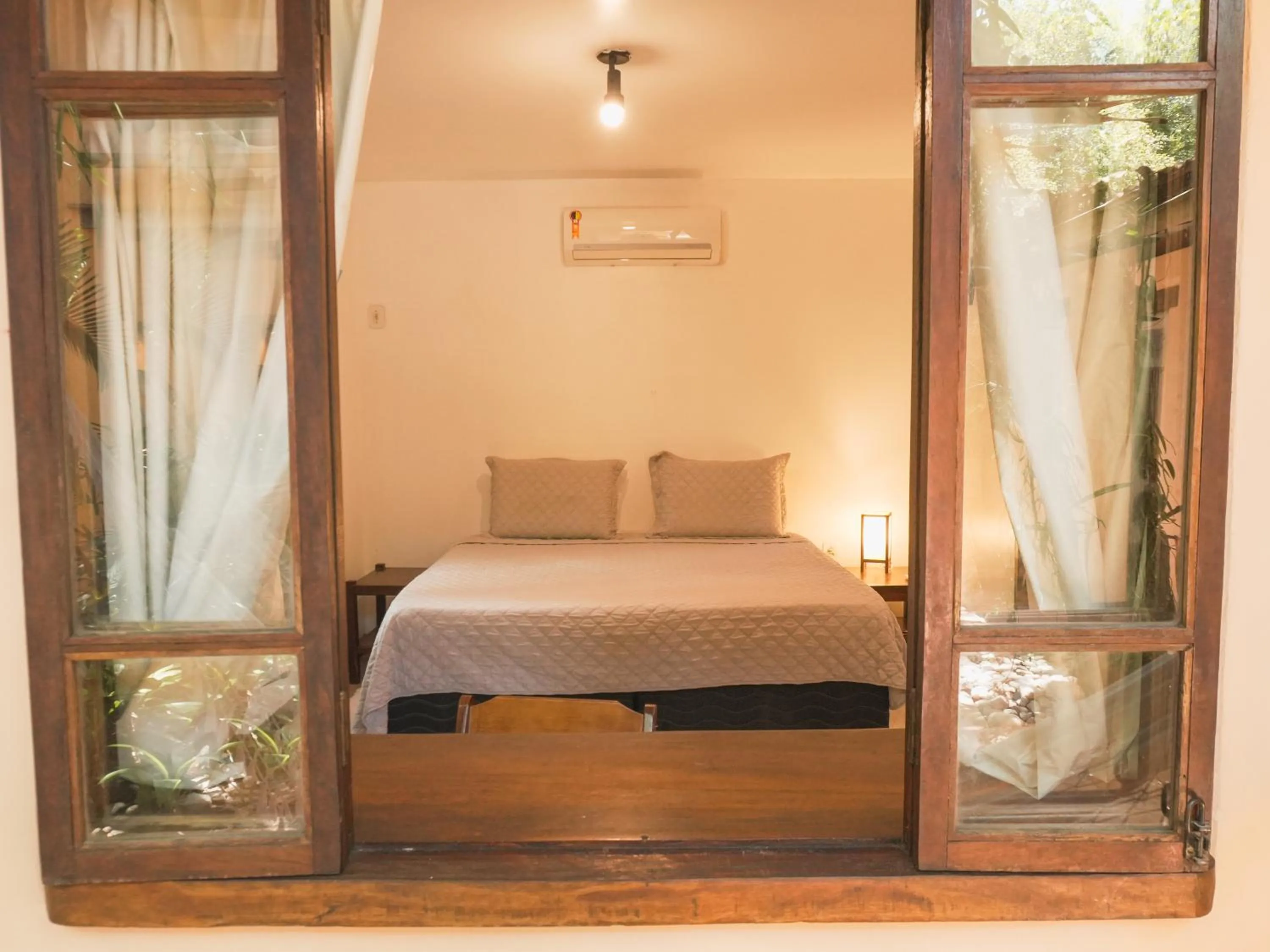 Bed in Pousada Erva Doce