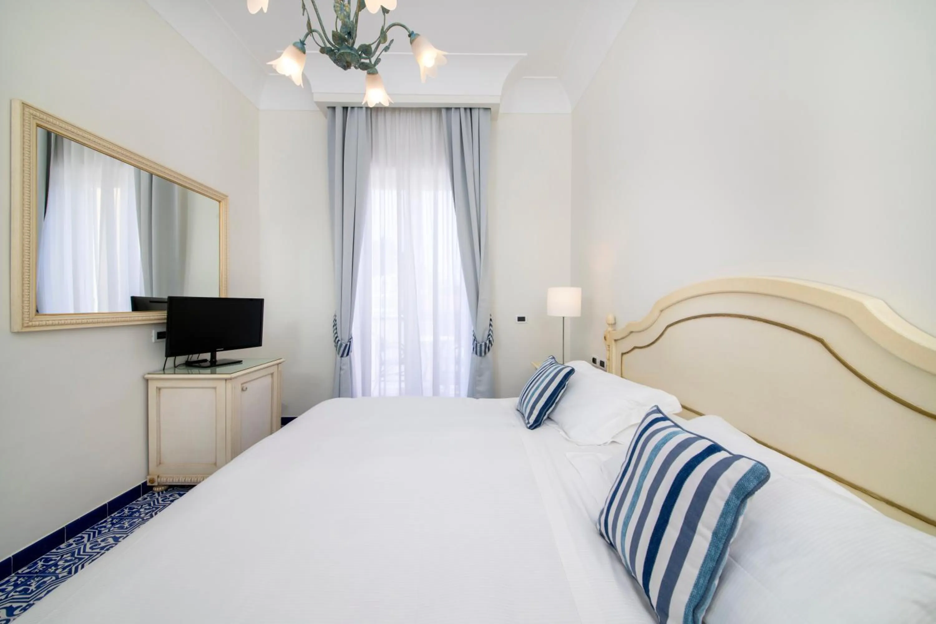 Bed in La Reginella Resort & Spa