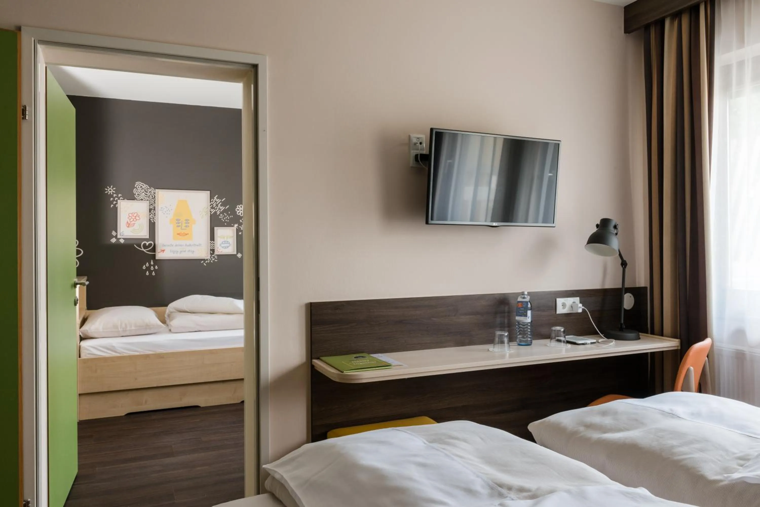 Photo of the whole room, Bed in JUFA Hotel Graz Süd - Self Check-in