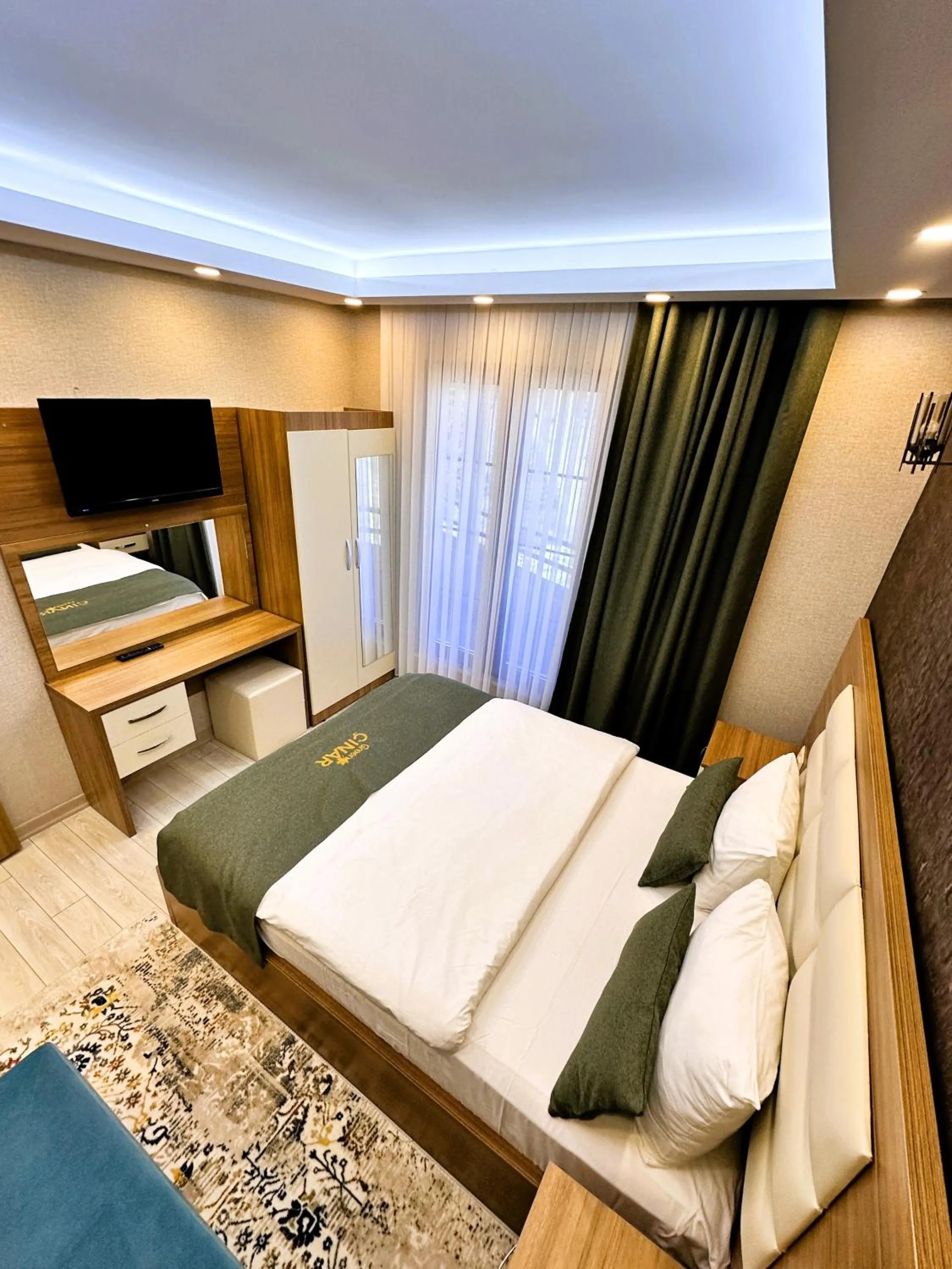 Bed in Green Cinar Apart