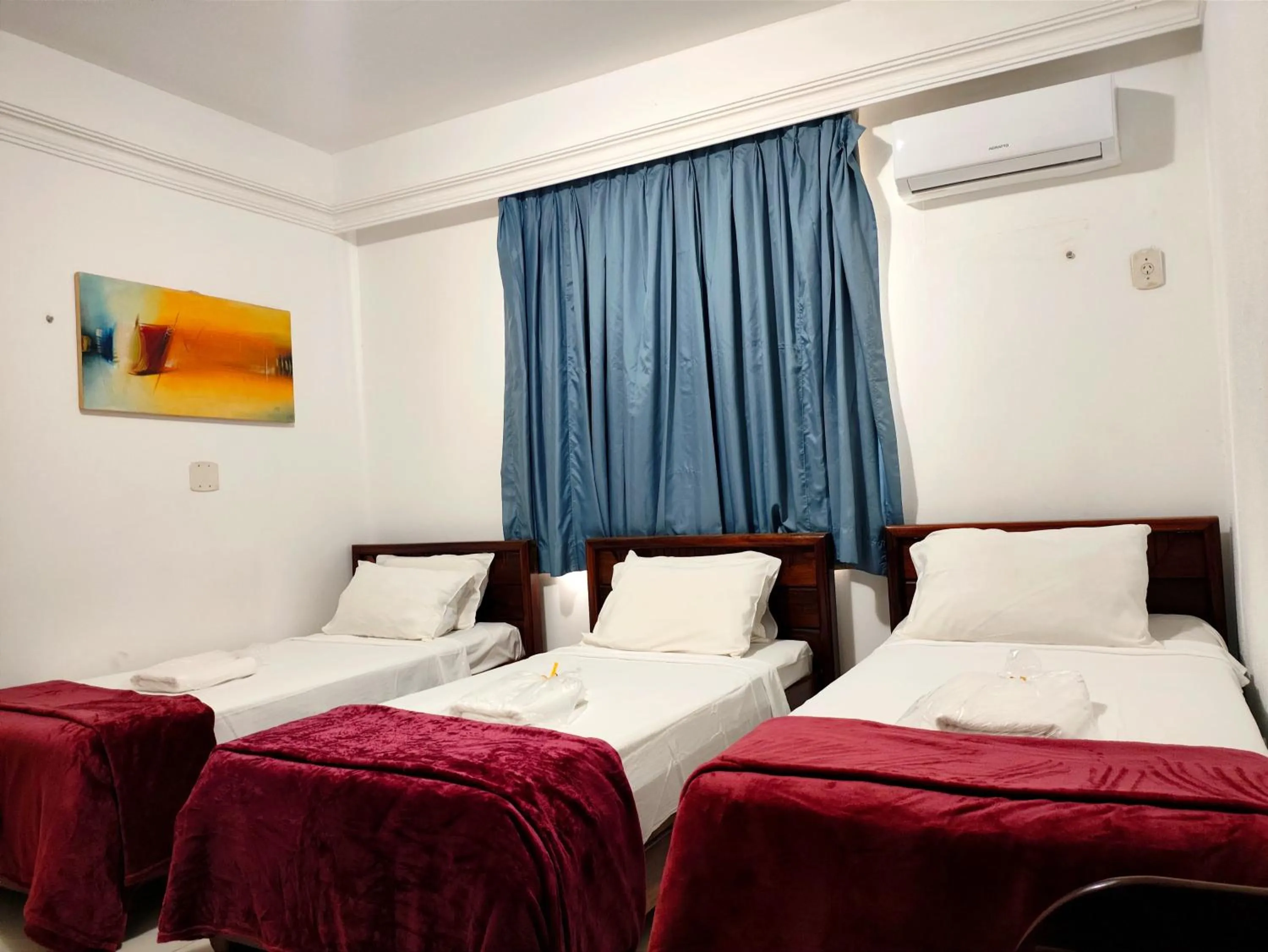 Bed in Machado´s Plaza Hotel