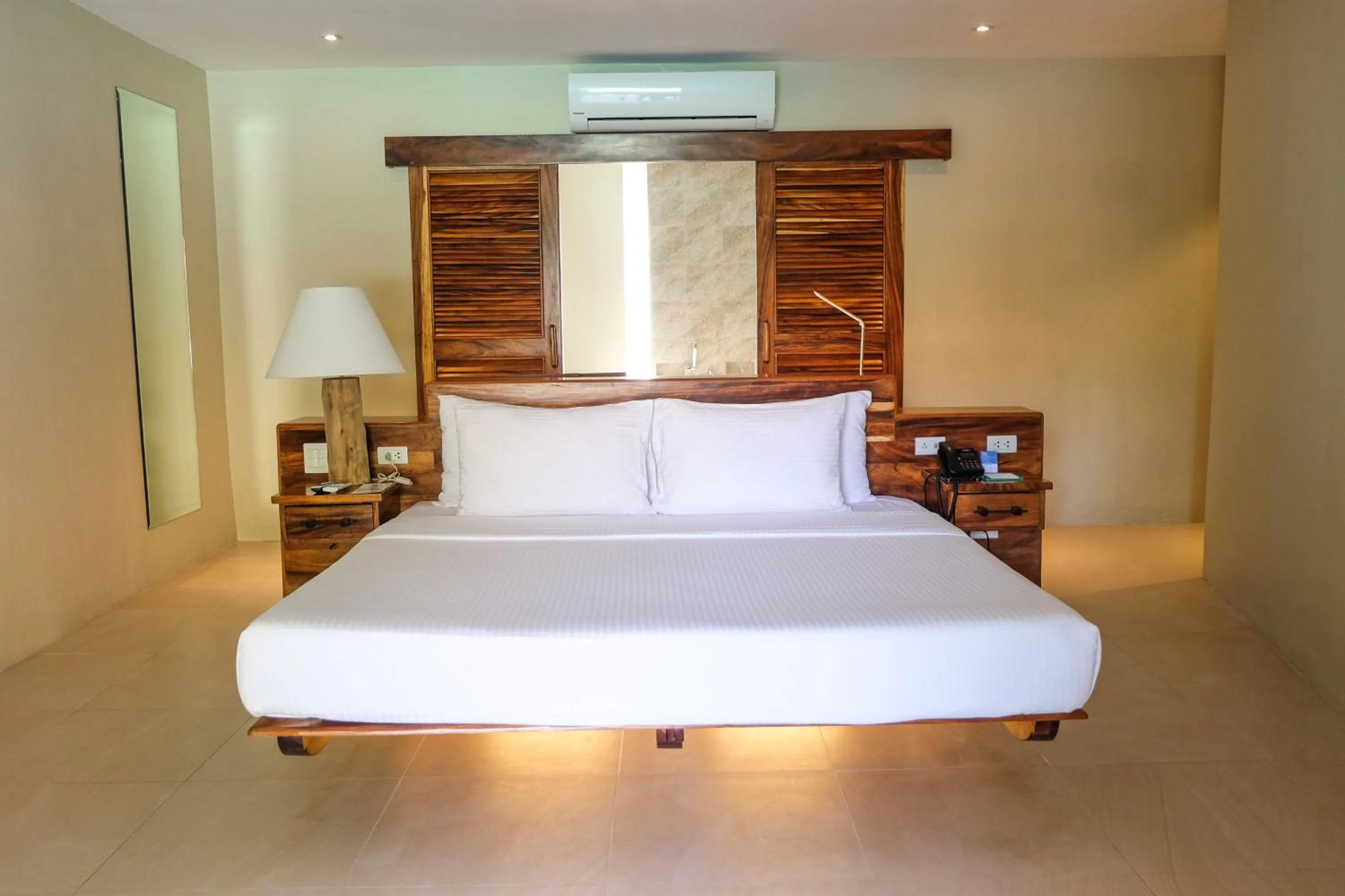 Bed in Bluewater Maribago Beach Resort