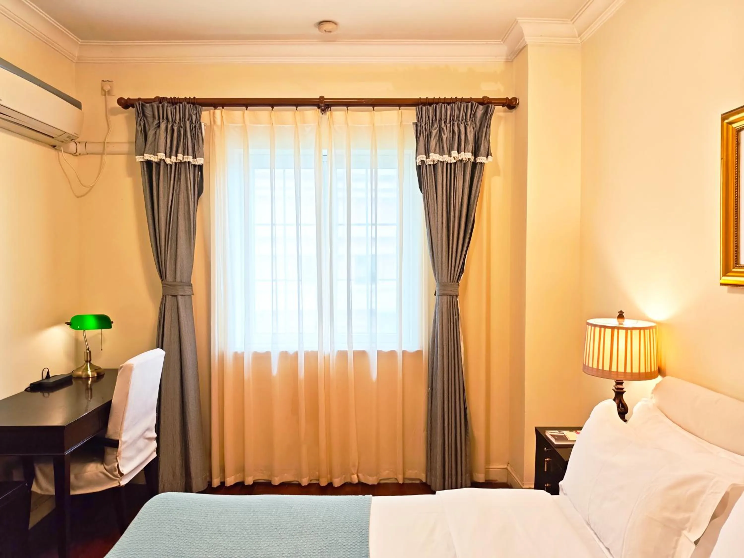 Bed in Ladoll Service Apartments