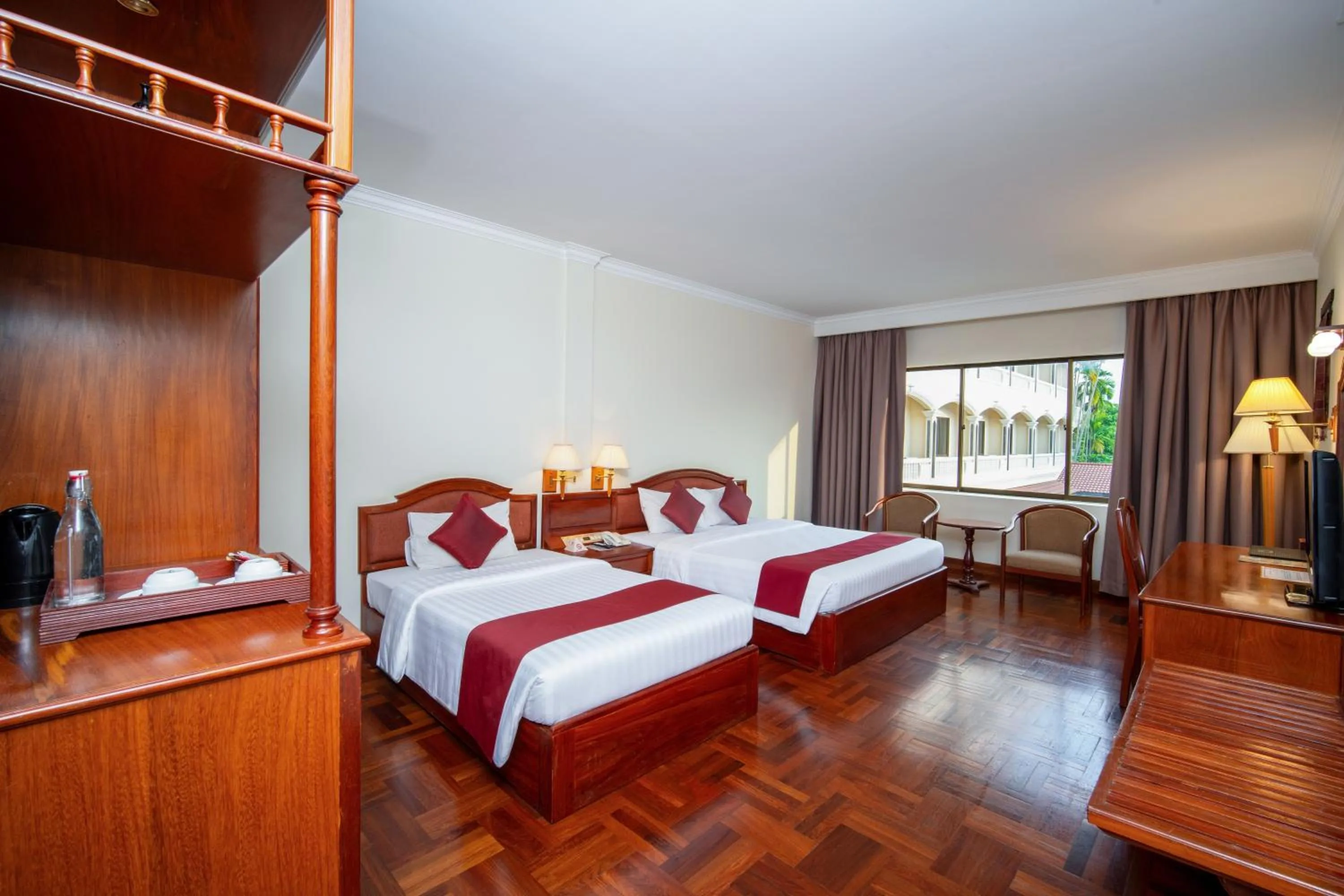 Bed in Khemara Angkor Hotel & Spa