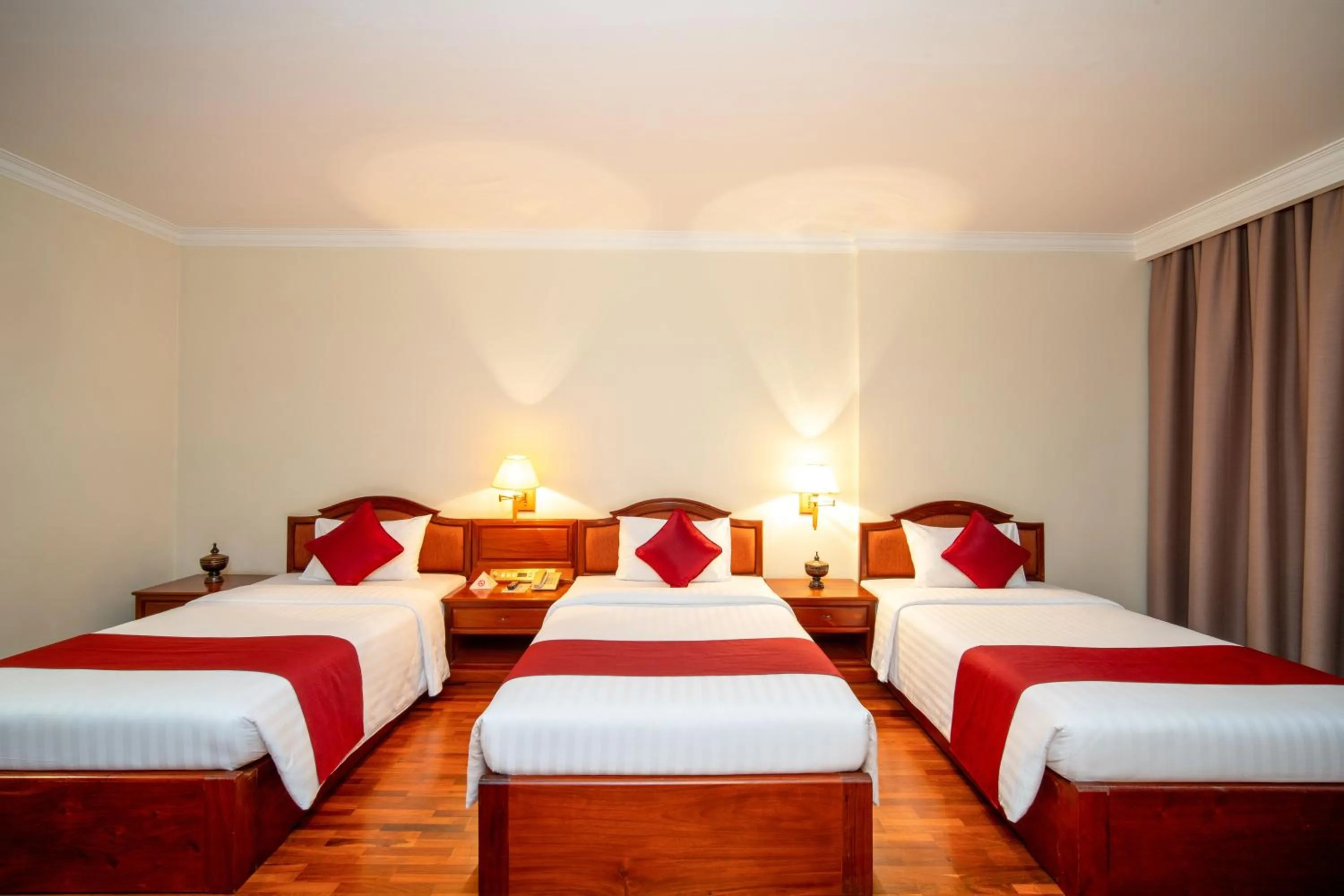 Bed in Khemara Angkor Hotel & Spa