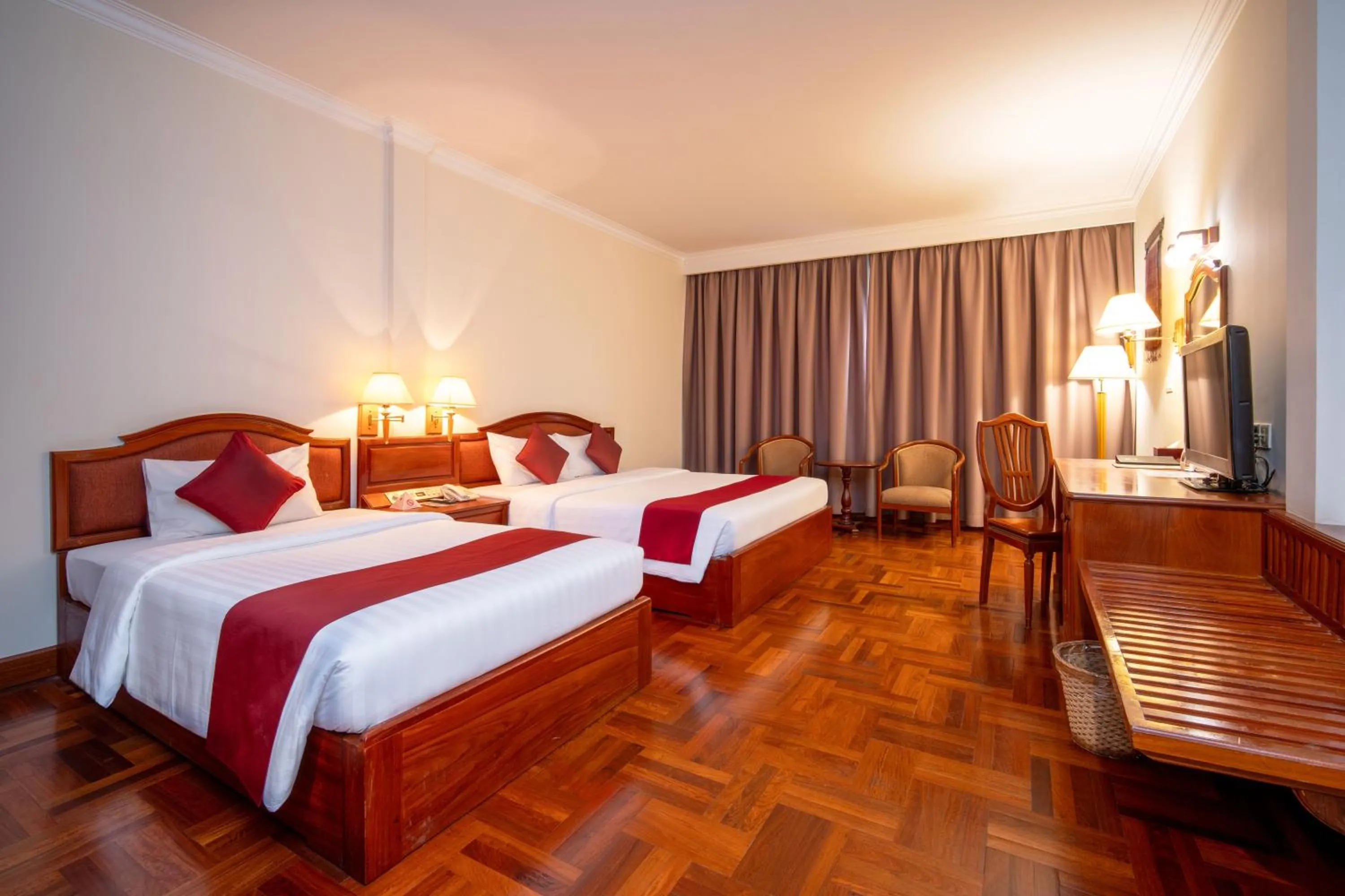 Bed in Khemara Angkor Hotel & Spa